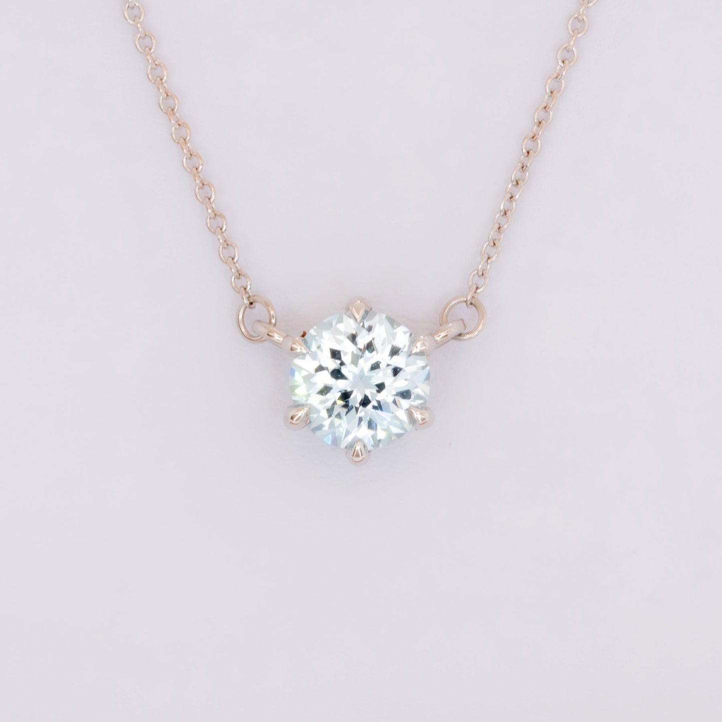 light blue sapphire round cygni necklace in white gold