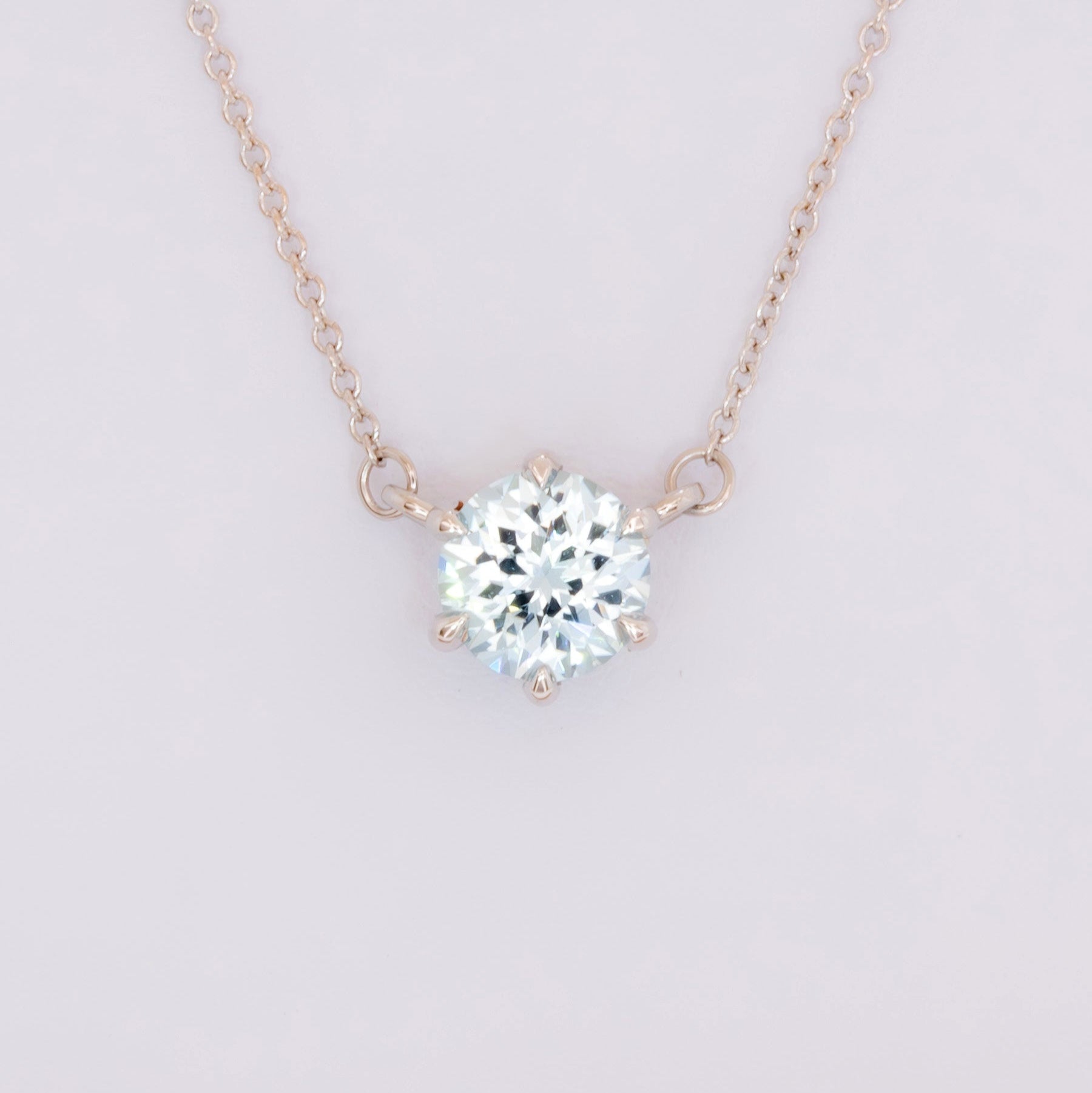 light blue sapphire round cygni necklace in white gold