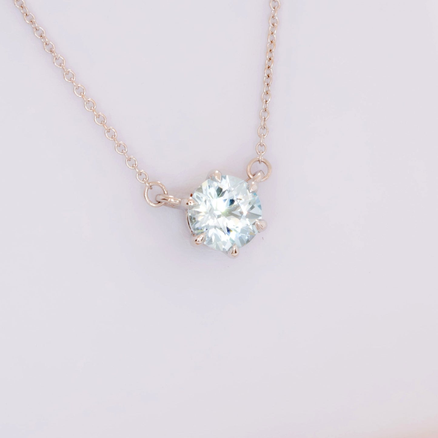 light blue sapphire round cygni necklace in white gold