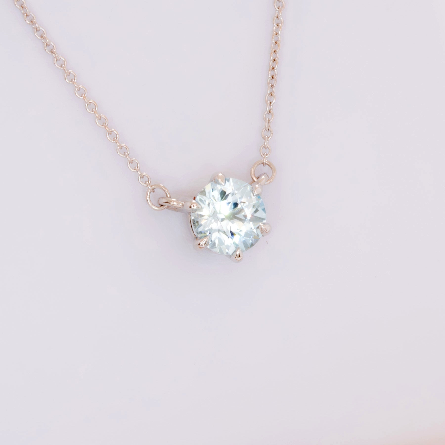 light blue sapphire round cygni necklace in white gold