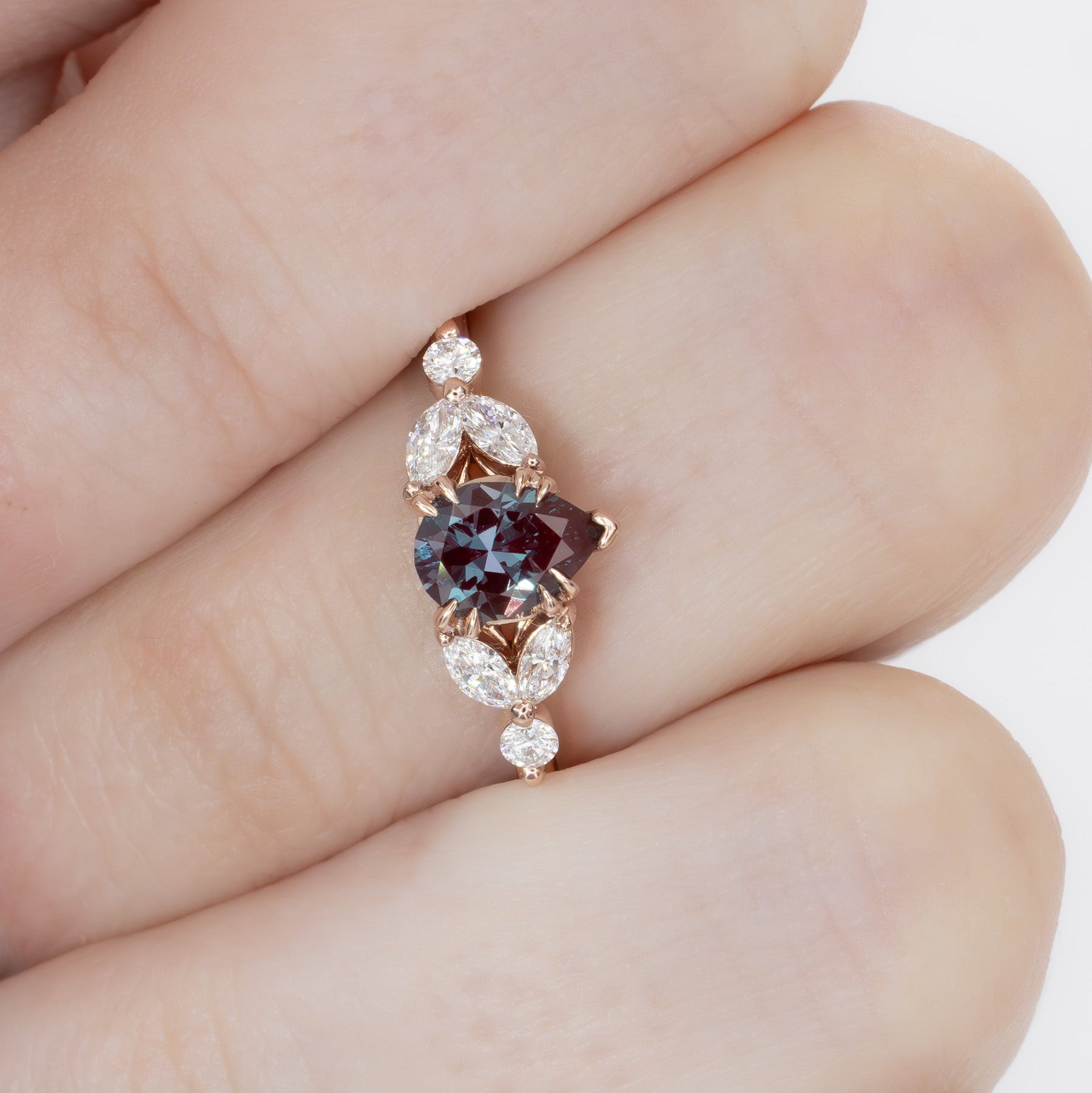 lili nature inspired engagement ring in rose gold with a pear lab alexandrite