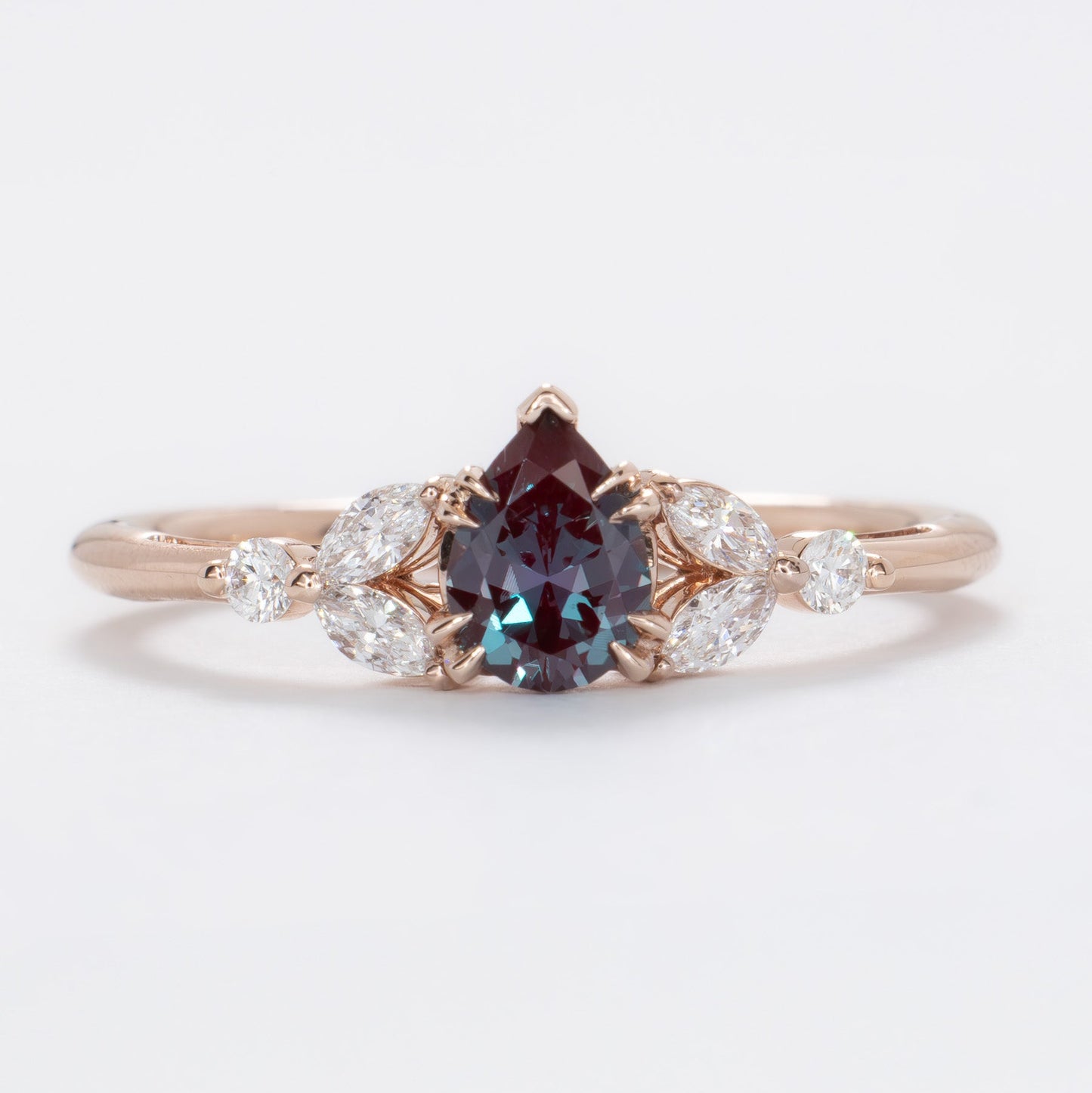 lili nature inspired engagement ring in rose gold with a pear lab alexandrite