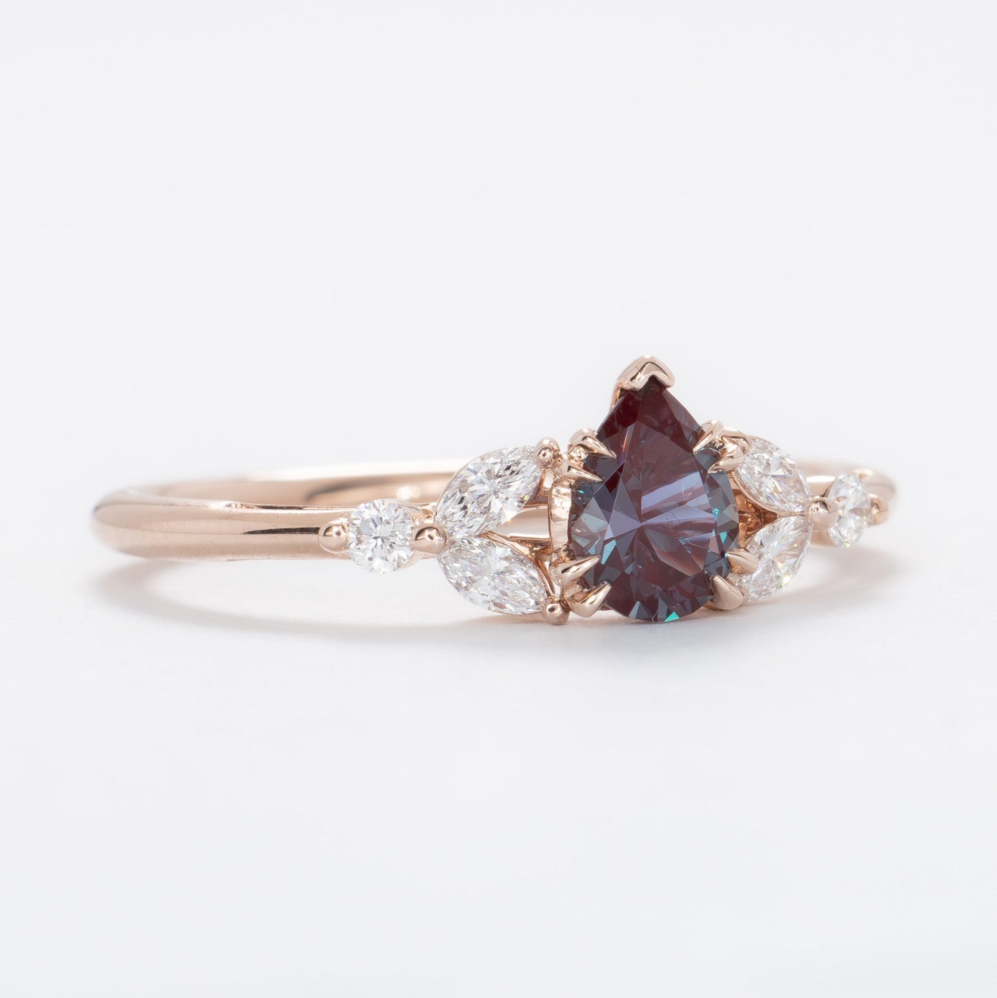 lili nature inspired engagement ring in rose gold with a pear lab alexandrite