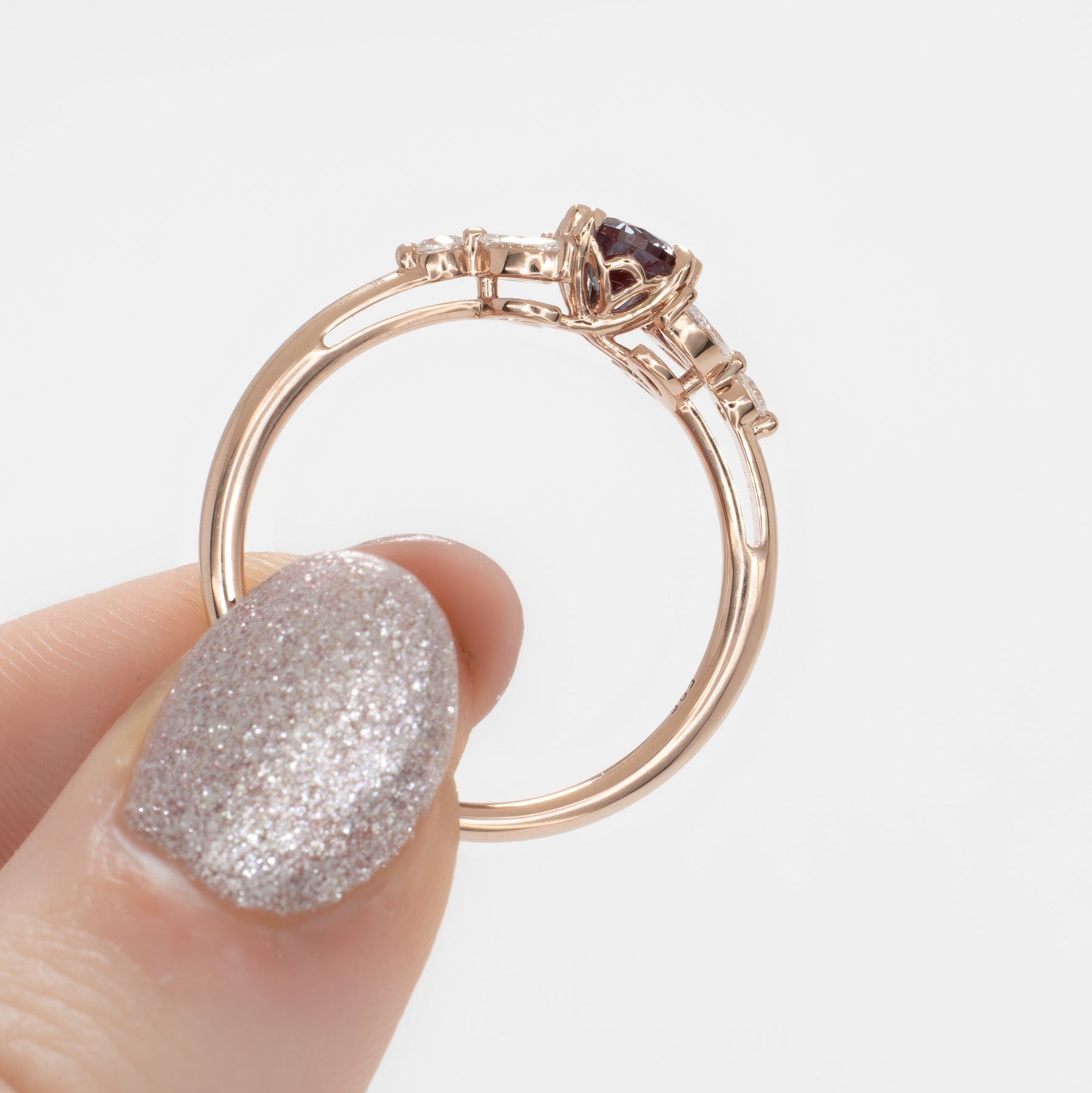 lili nature inspired engagement ring in rose gold with a pear lab alexandrite