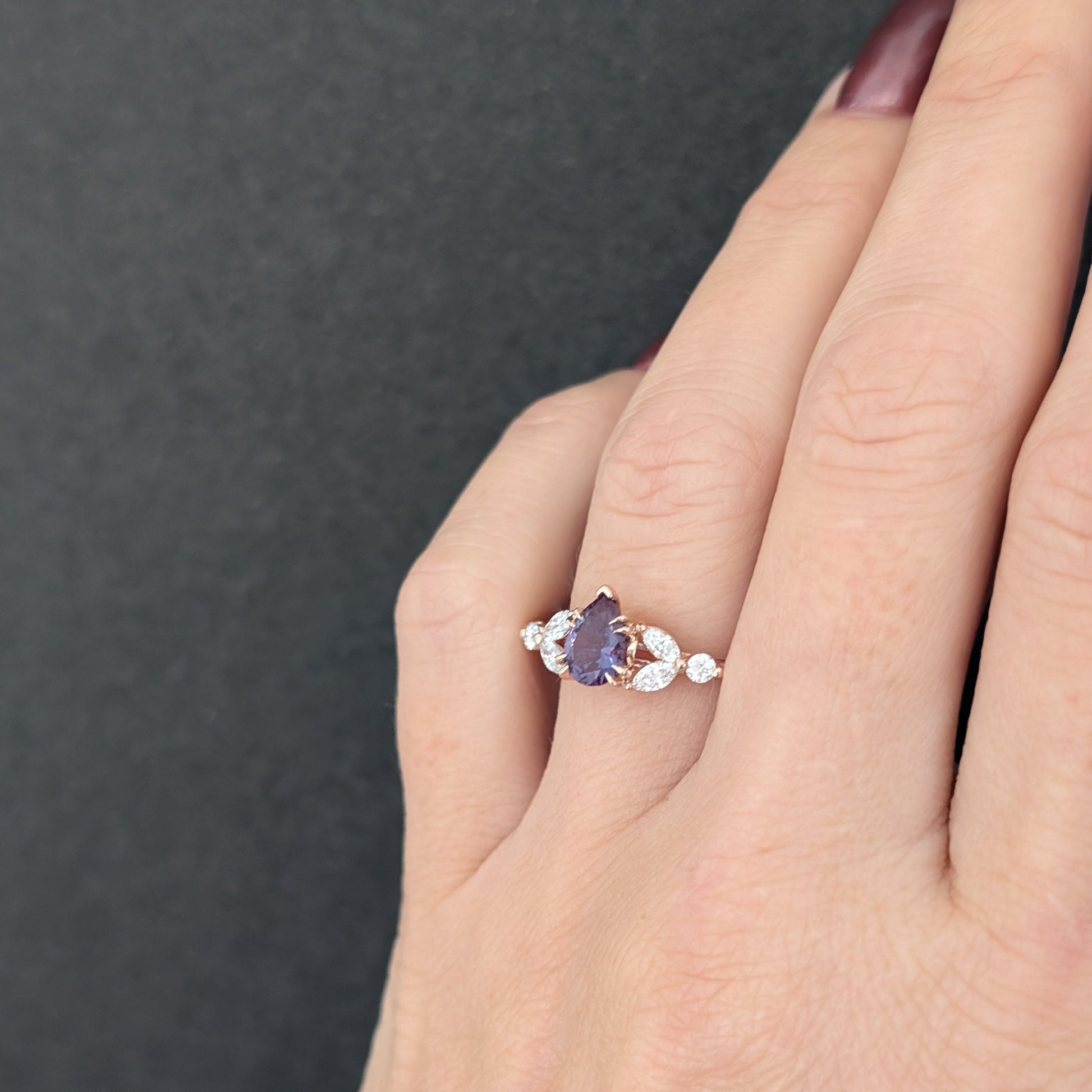 lili nature inspired engagement ring in rose gold with a pear lab alexandrite