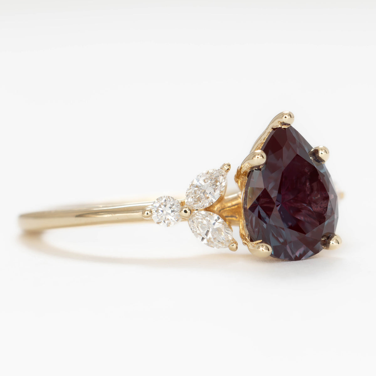lili nature inspired engagement ring in yellow gold with pear lab alexandrite