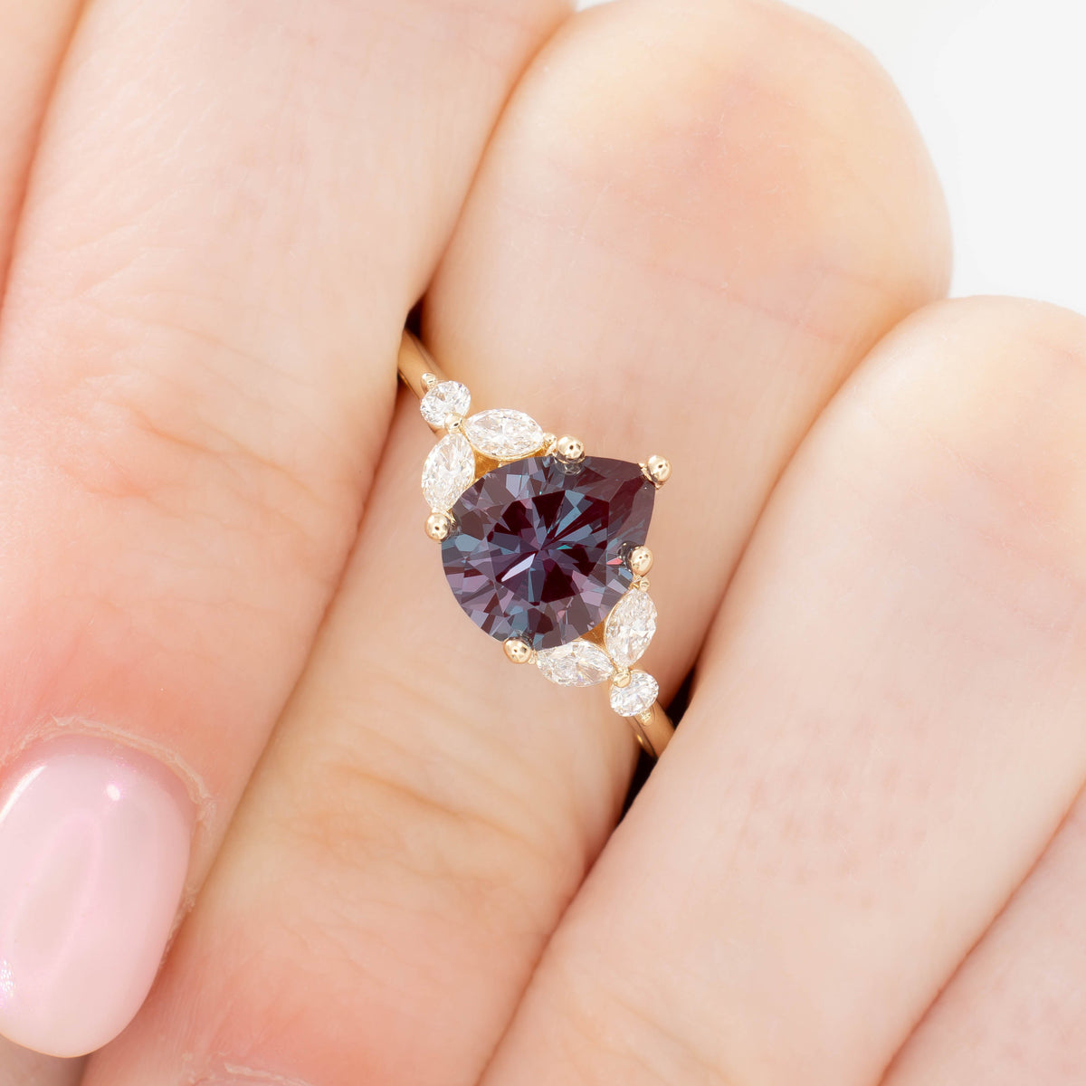 lili nature inspired engagement ring in yellow gold with pear lab alexandrite