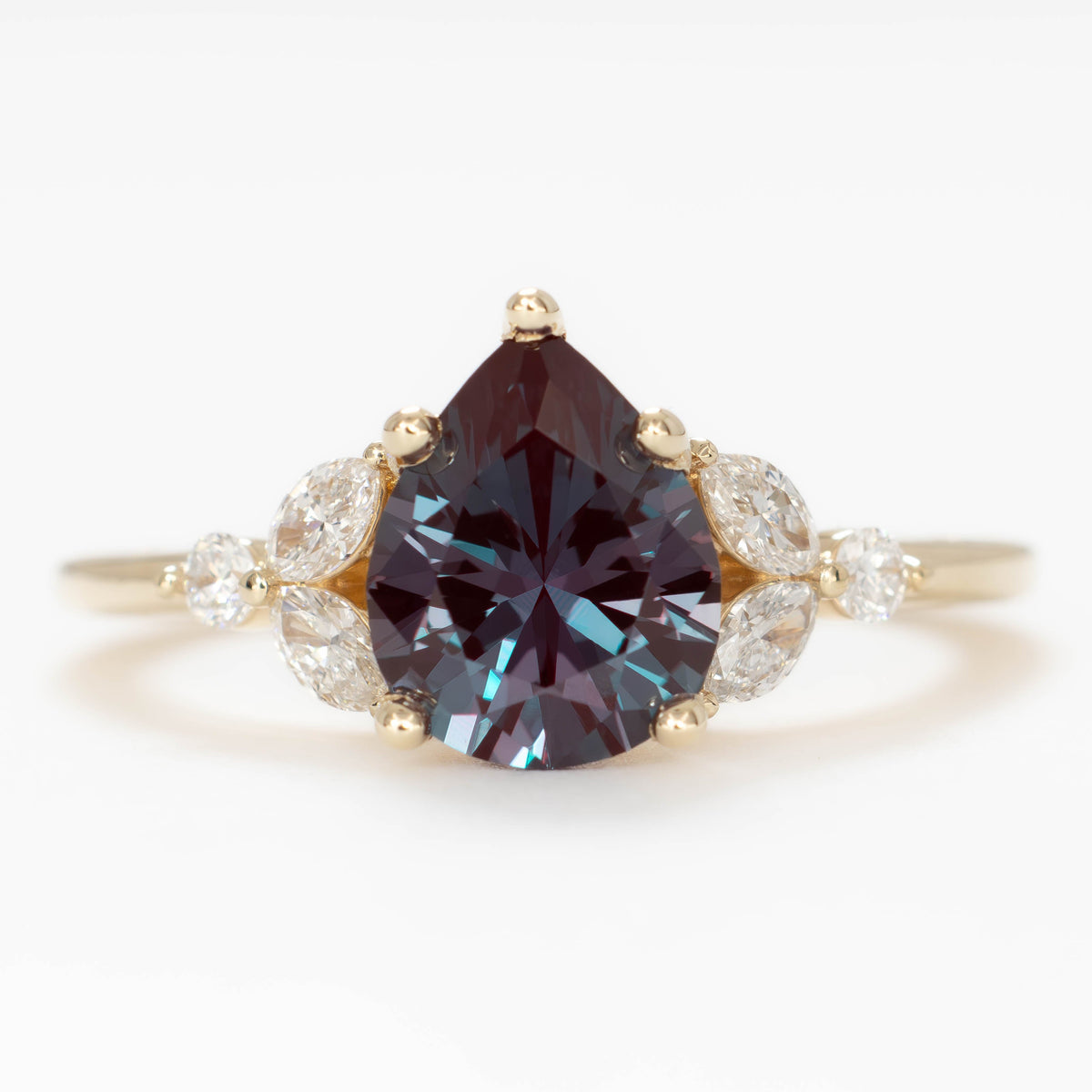 lili nature inspired engagement ring in yellow gold with pear lab alexandrite