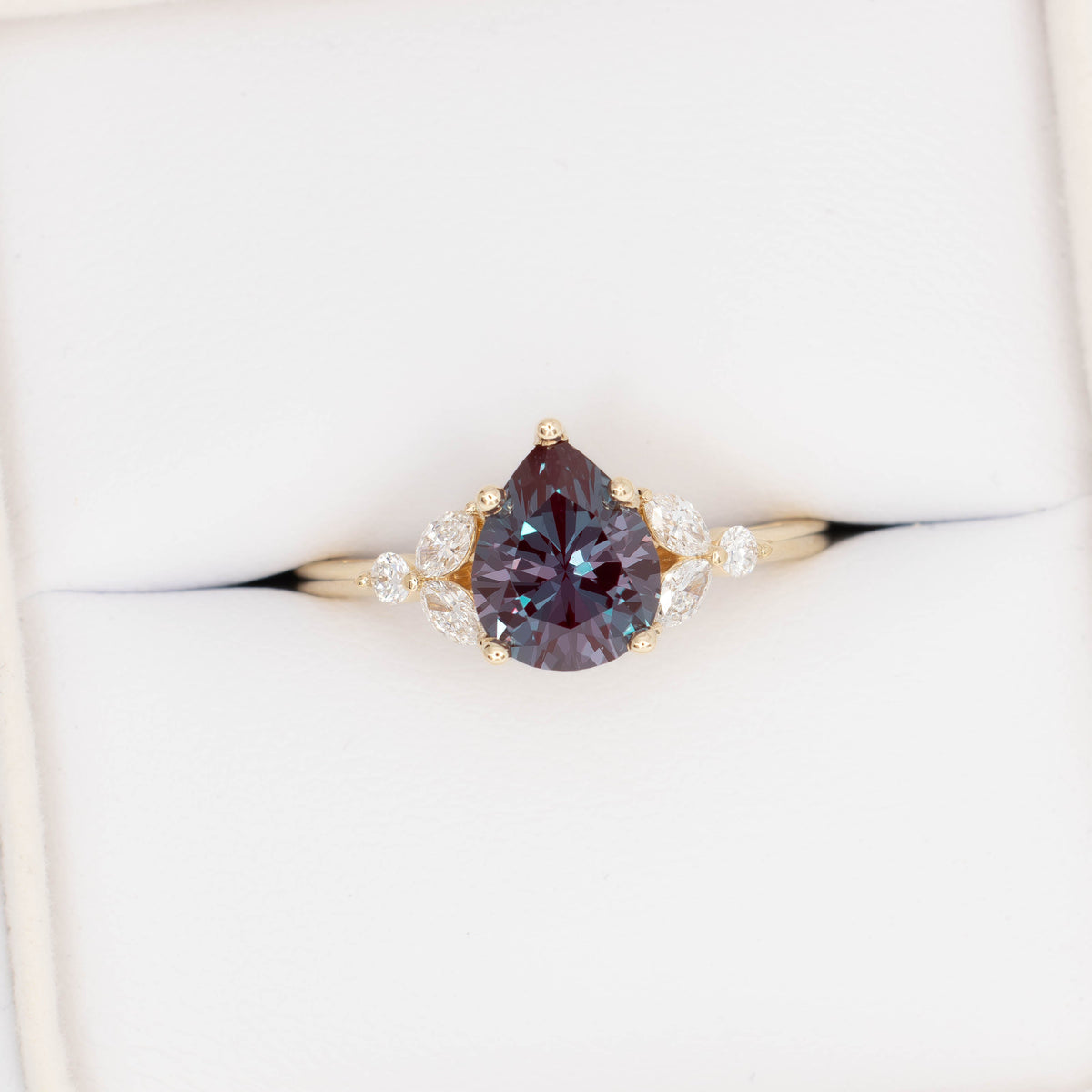 lili nature inspired engagement ring in yellow gold with pear lab alexandrite