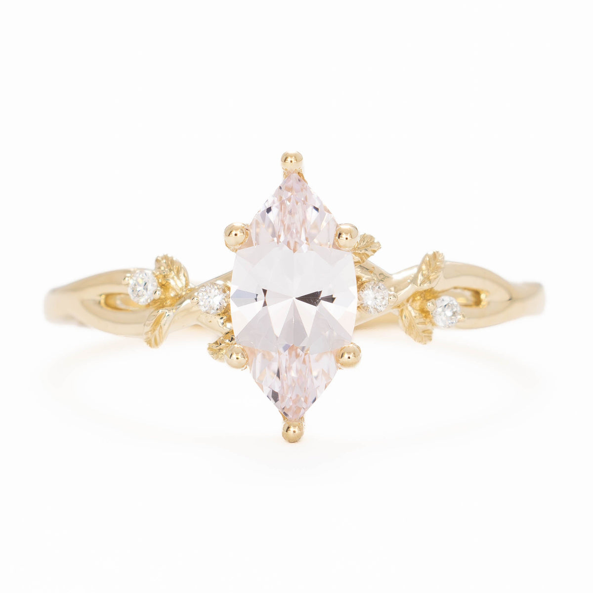 A beautiful garden to be worn everyday, Lillian's delicate vines and leaves will hold your perfect gem as well as your heart.