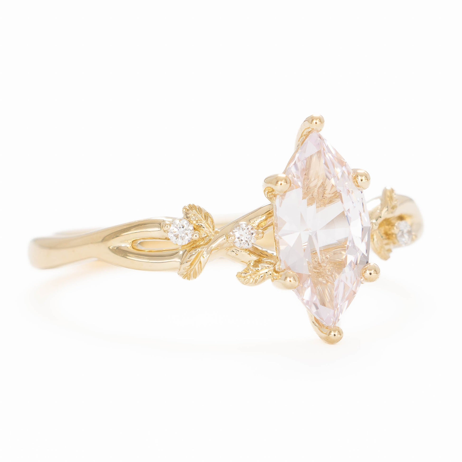 A beautiful garden to be worn everyday, Lillian's delicate vines and leaves will hold your perfect gem as well as your heart.