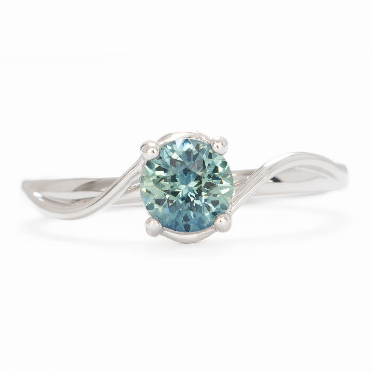 liyana bypass solitaire ring in white gold with natural round sapphire
