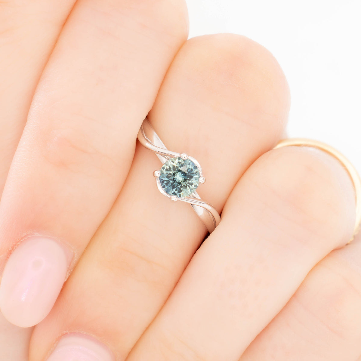 liyana bypass solitaire ring in white gold with natural round sapphire