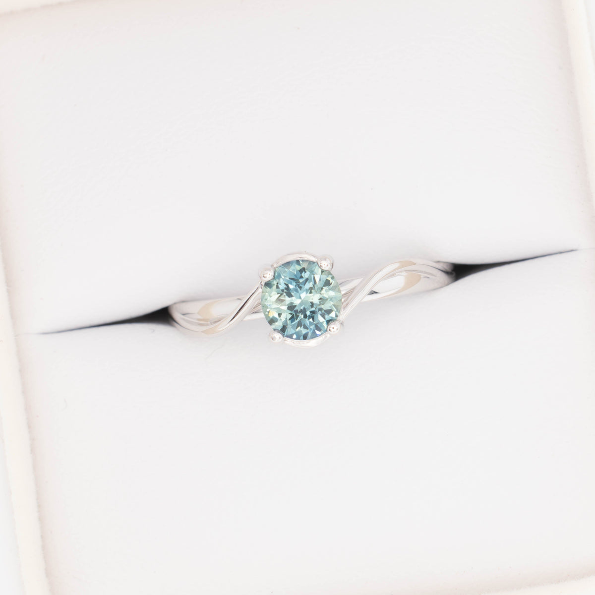 liyana bypass solitaire ring in white gold with natural round sapphire