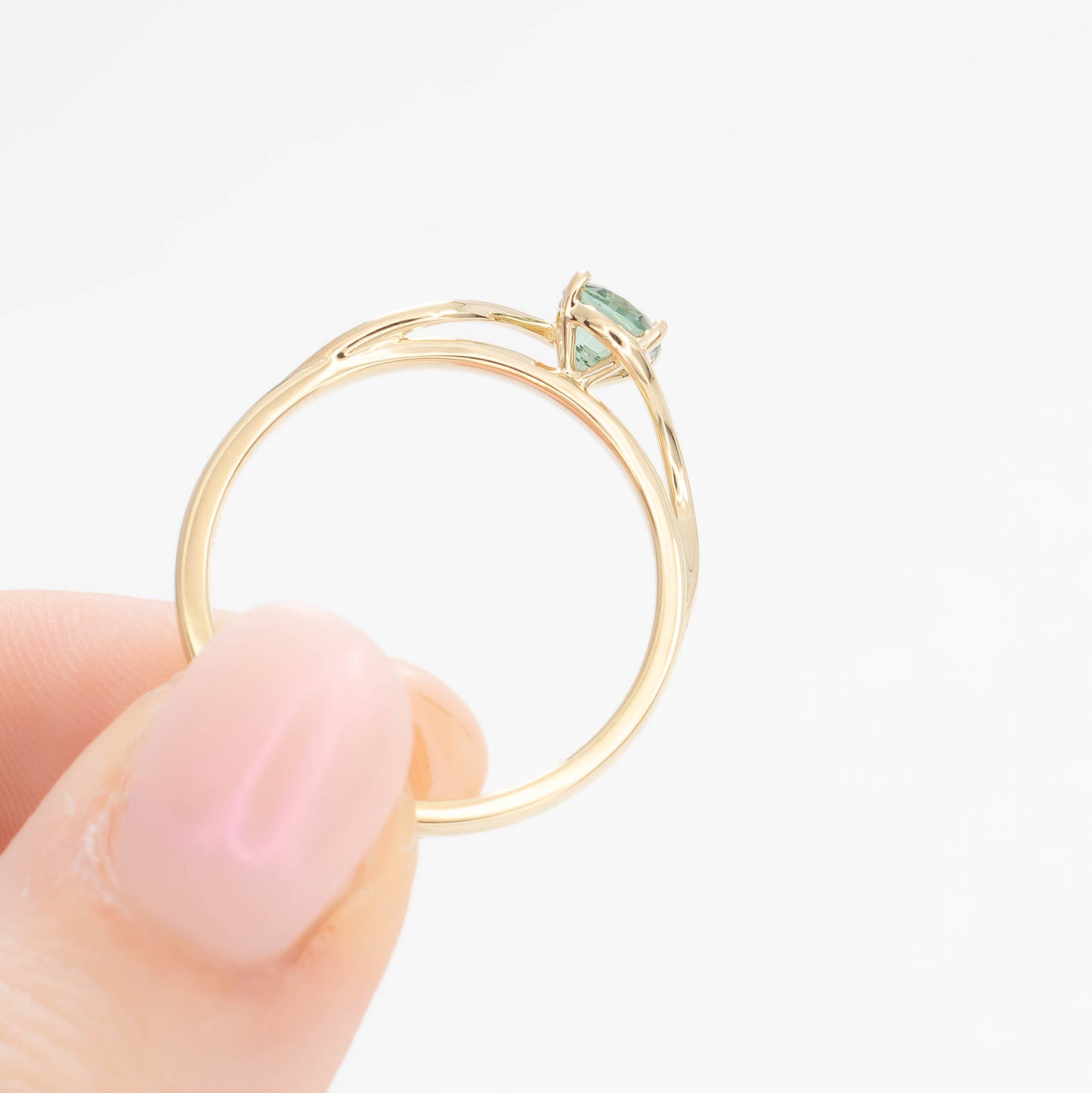 liyana solitaire bypass engagement ring with green lab sapphire cushion
