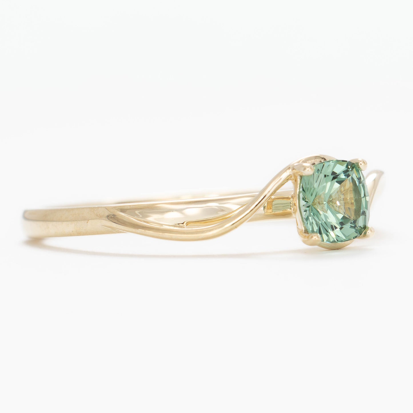 liyana solitaire bypass engagement ring with green lab sapphire cushion