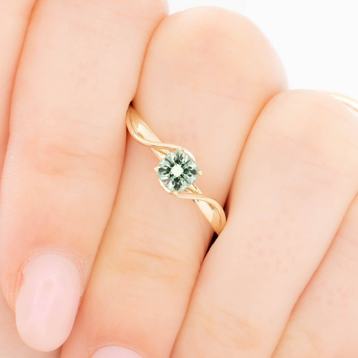 liyana solitaire bypass engagement ring with green lab sapphire cushion