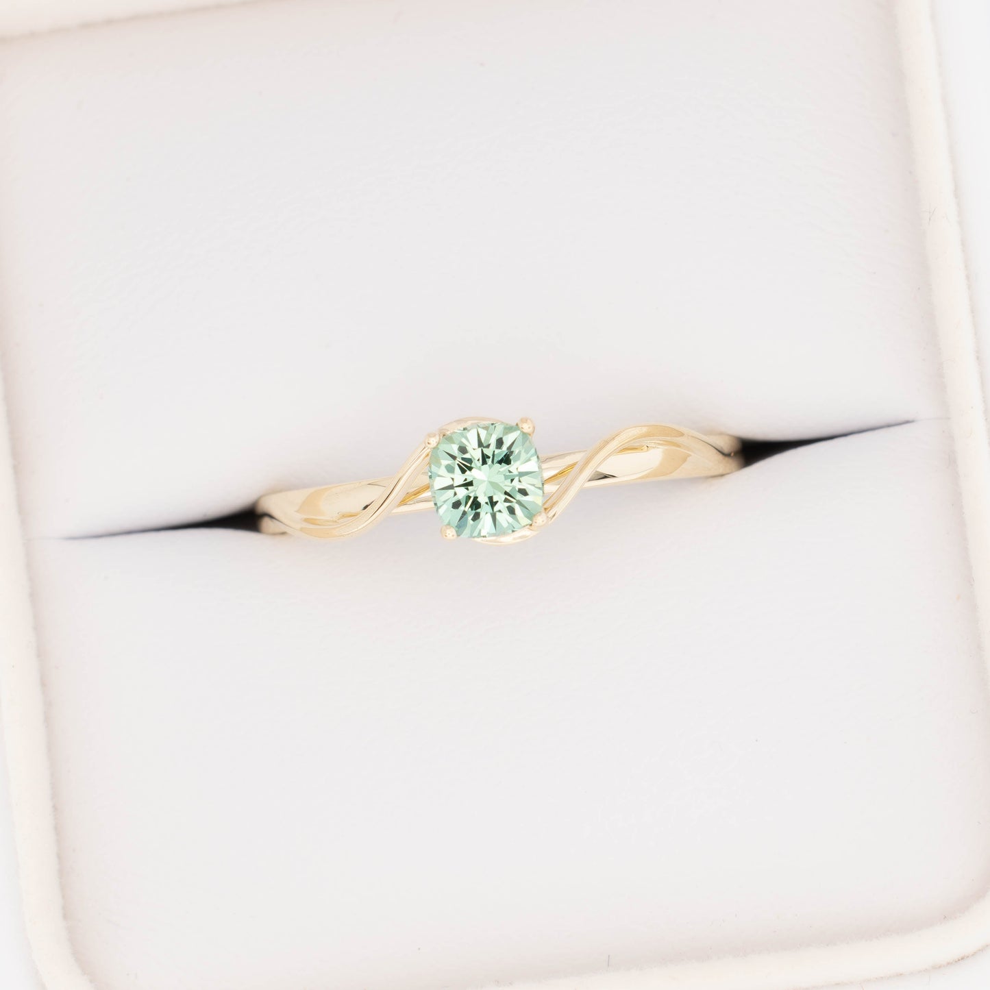 liyana solitaire bypass engagement ring with green lab sapphire cushion