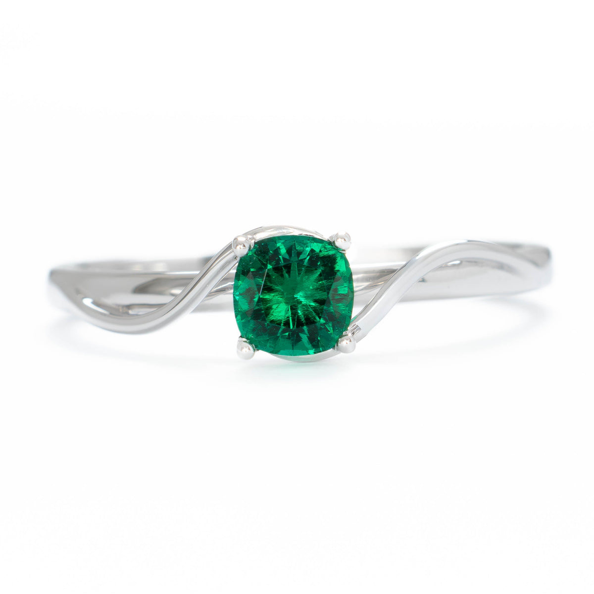 liyana solitaire bypass ring in white gold with cushion lab emerald