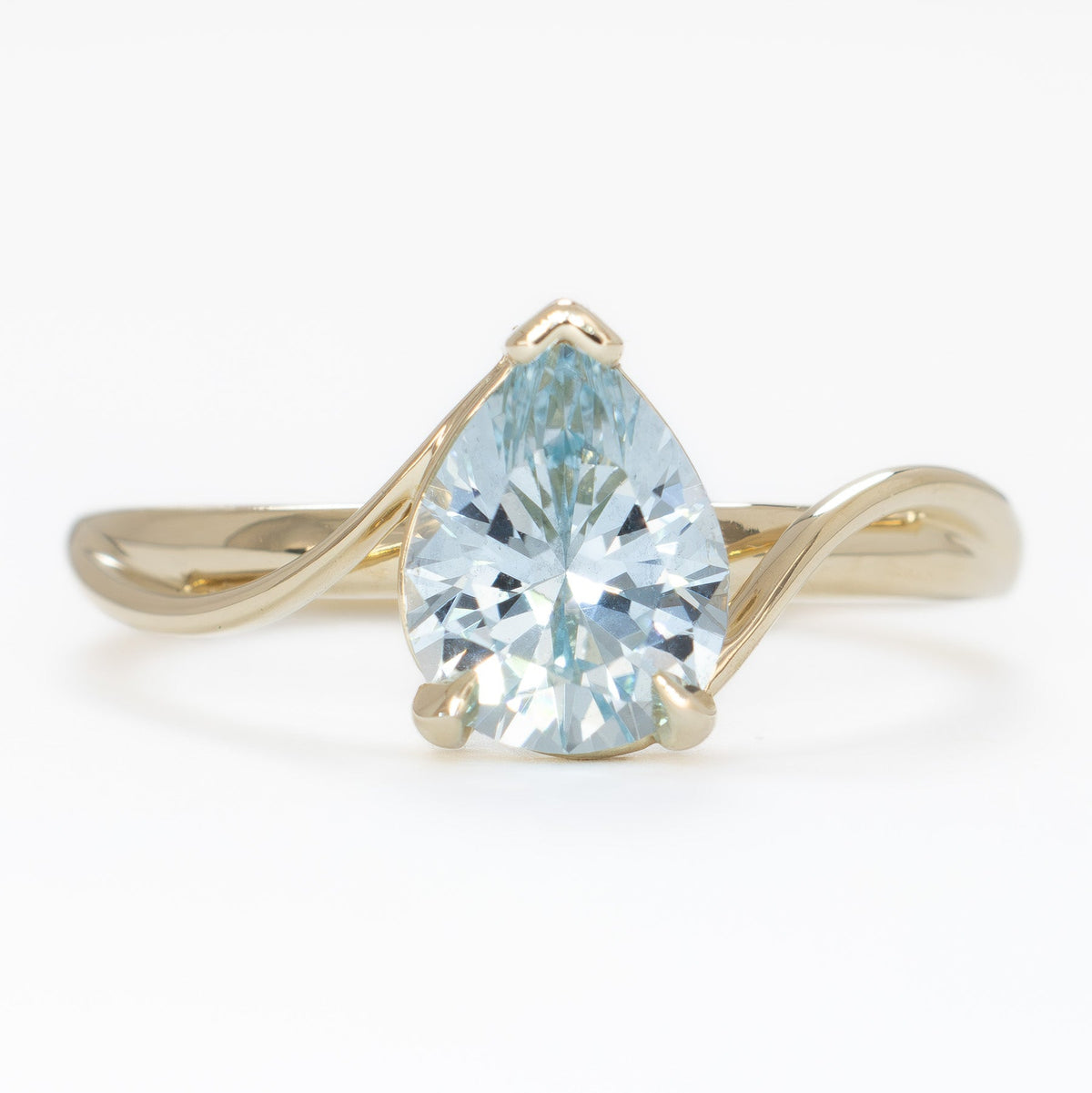 liyana solitaire ring in yellow gold with light blue lab sapphire pear