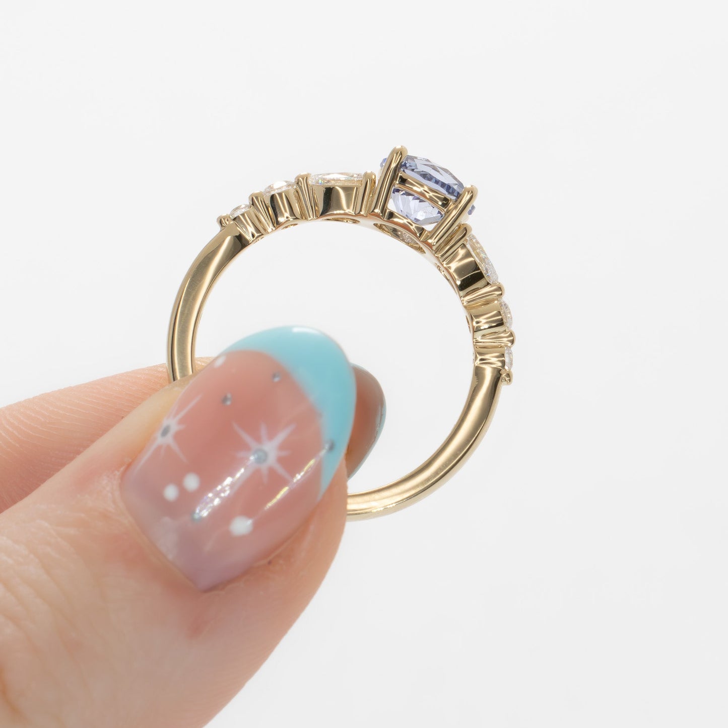 maeve ring in yellow gold with light blue round lab sapphire