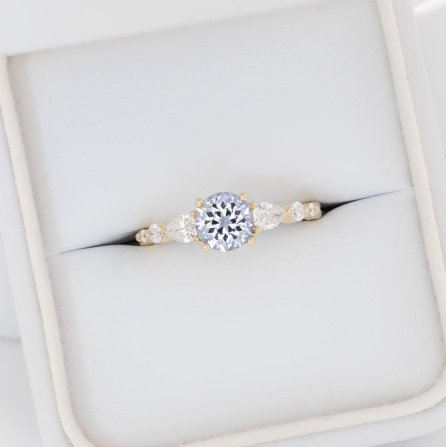 maeve ring in yellow gold with light blue round lab sapphire