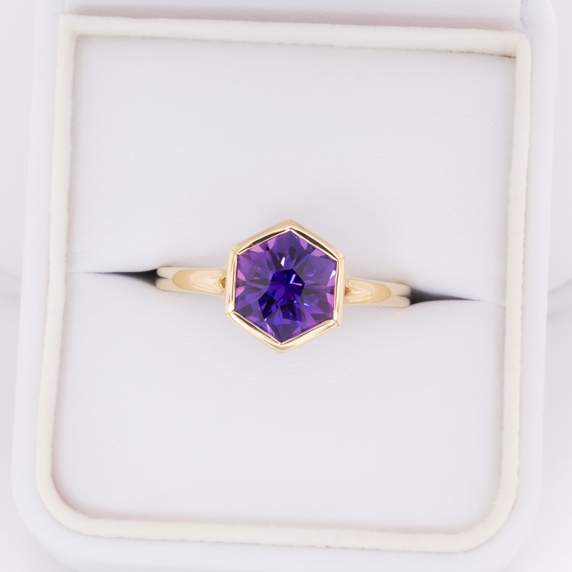 margot bezel set solitaire ring with hex cut lab sapphire