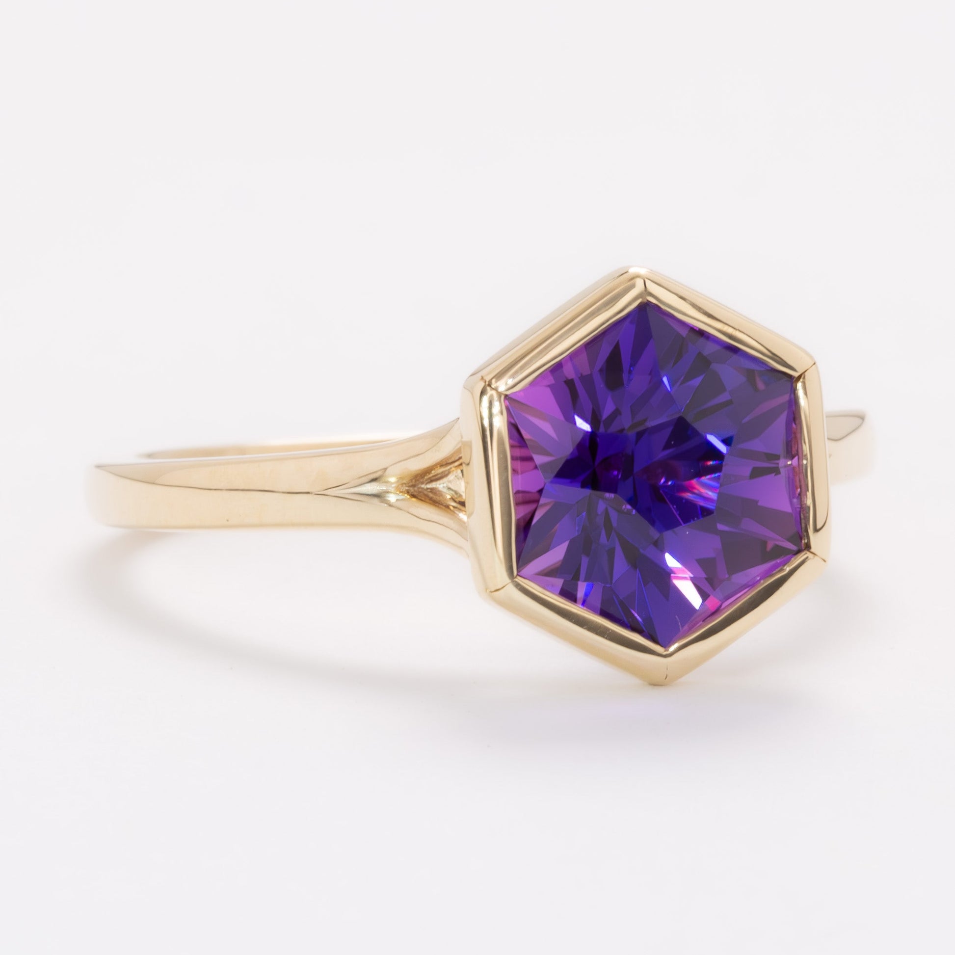 margot bezel set solitaire ring with hex cut lab sapphire