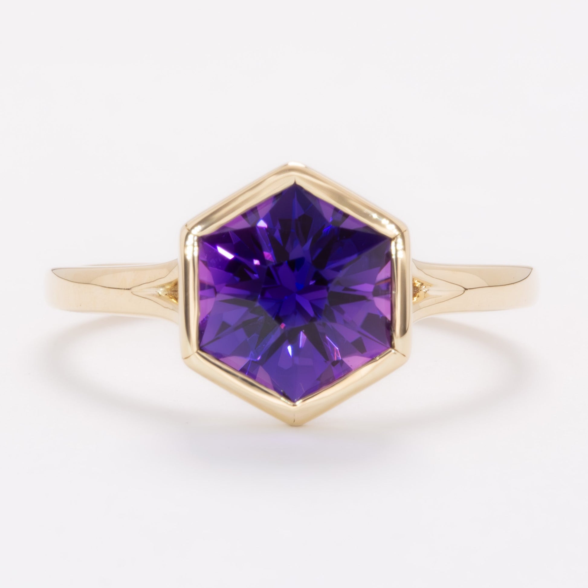 margot bezel set solitaire ring with hex cut lab sapphire