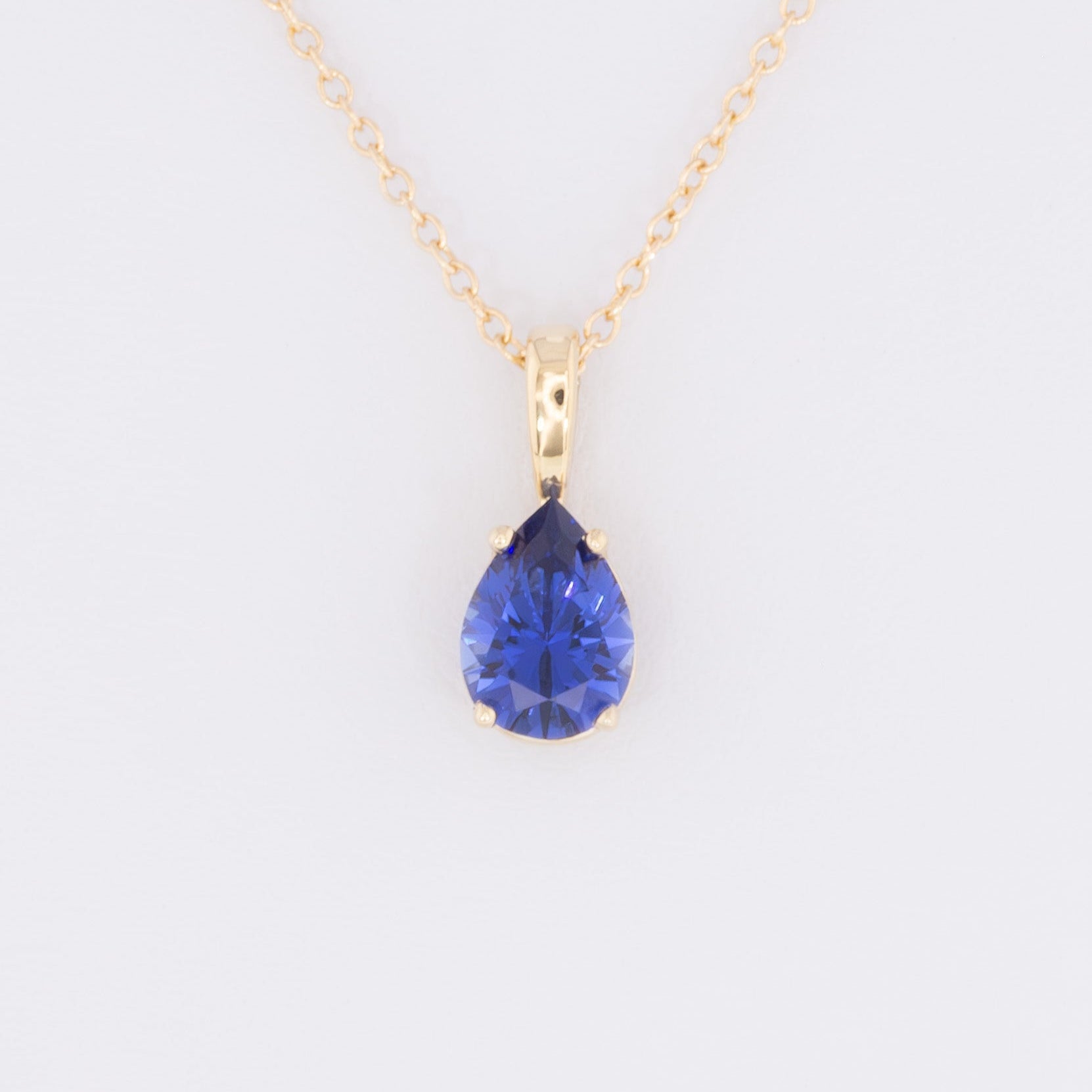 marley necklace in yellow gold and royal blue pear lab sapphire