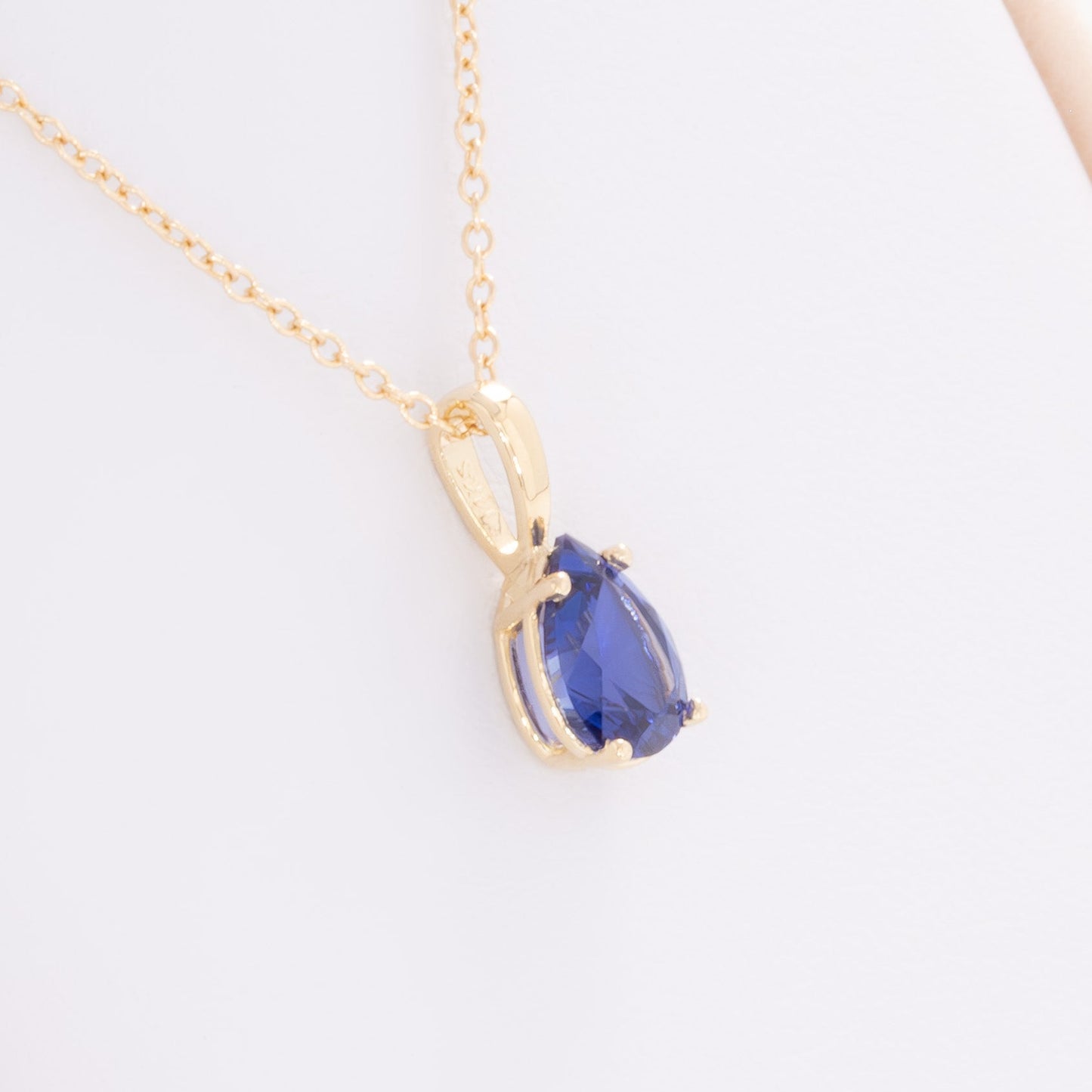 marley necklace in yellow gold and royal blue pear lab sapphire