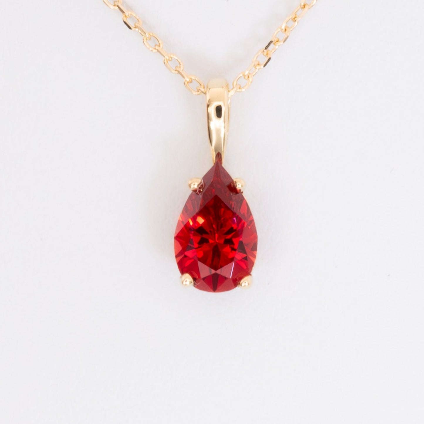 marley necklace in yellow gold with pear cut lab ruby
