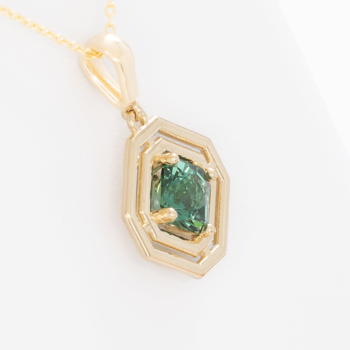 milan geometric necklace in yellow gold with green lab sapphire asscher
