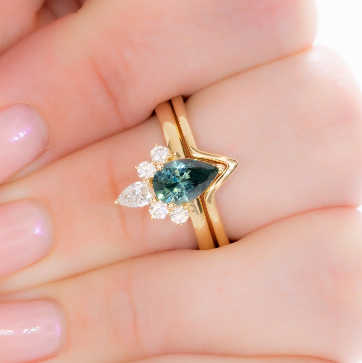 miley engagement ring with pear cut green sapphire