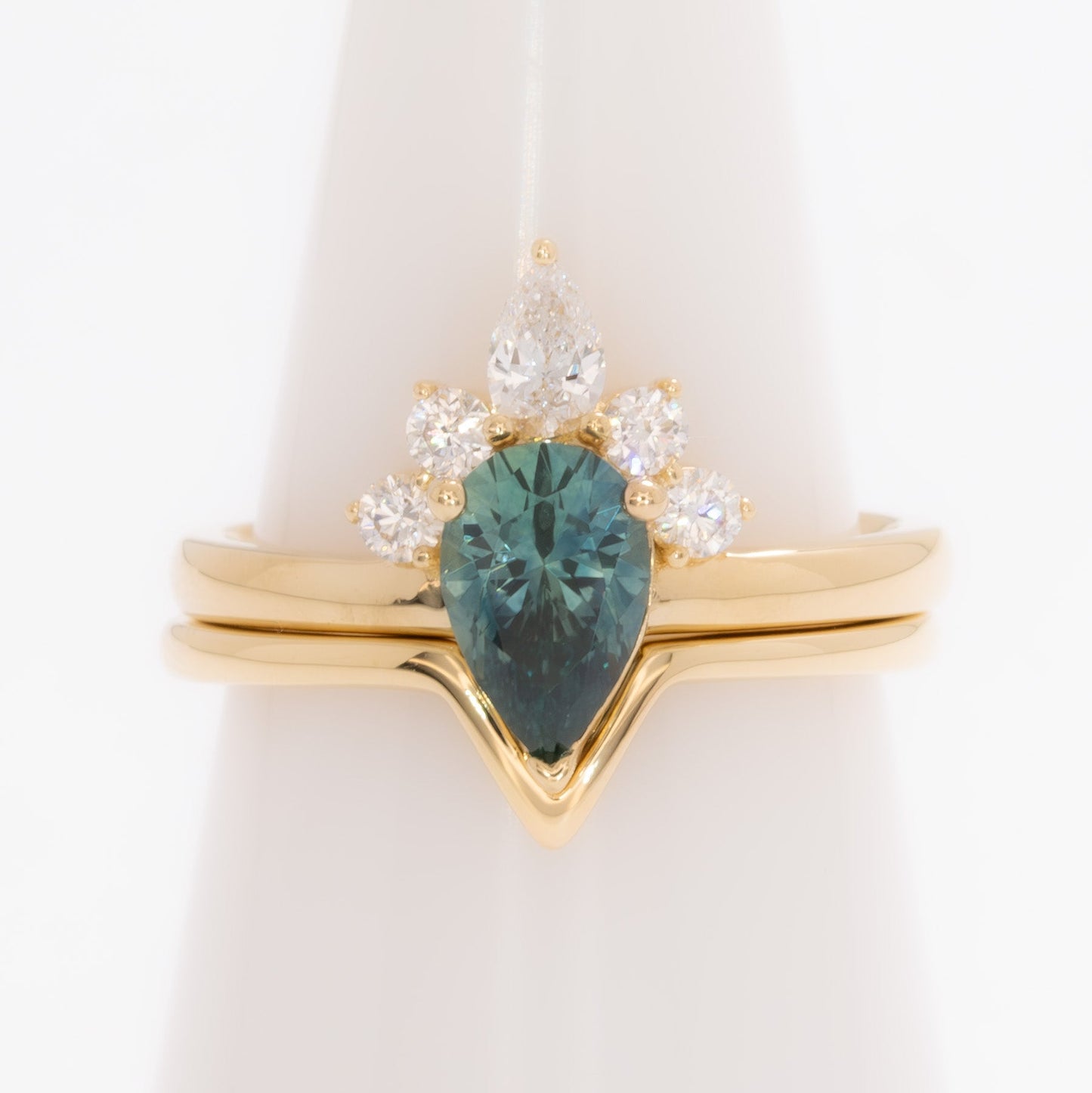 miley engagement ring with pear cut green sapphire