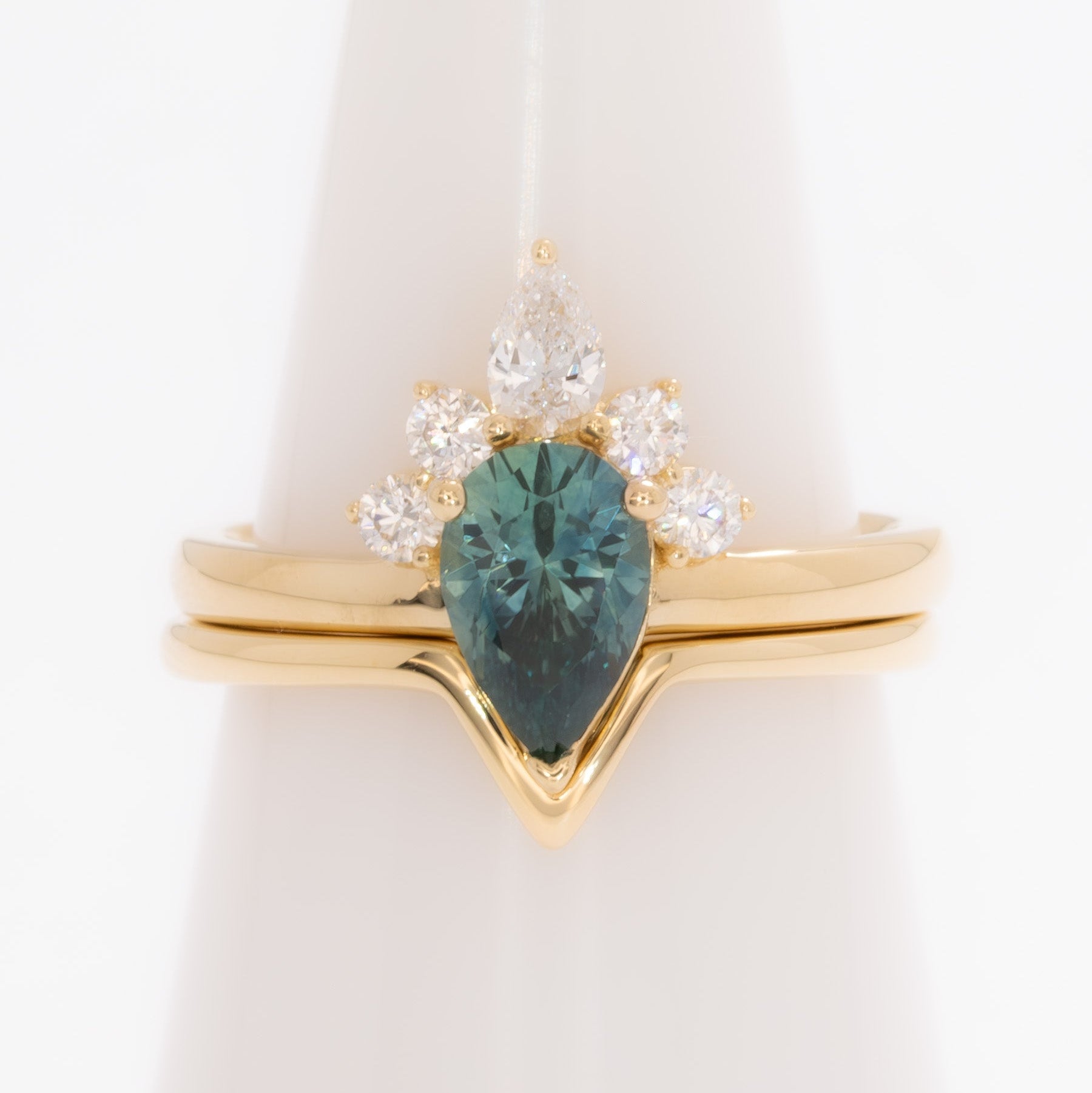 miley engagement ring with pear cut green sapphire