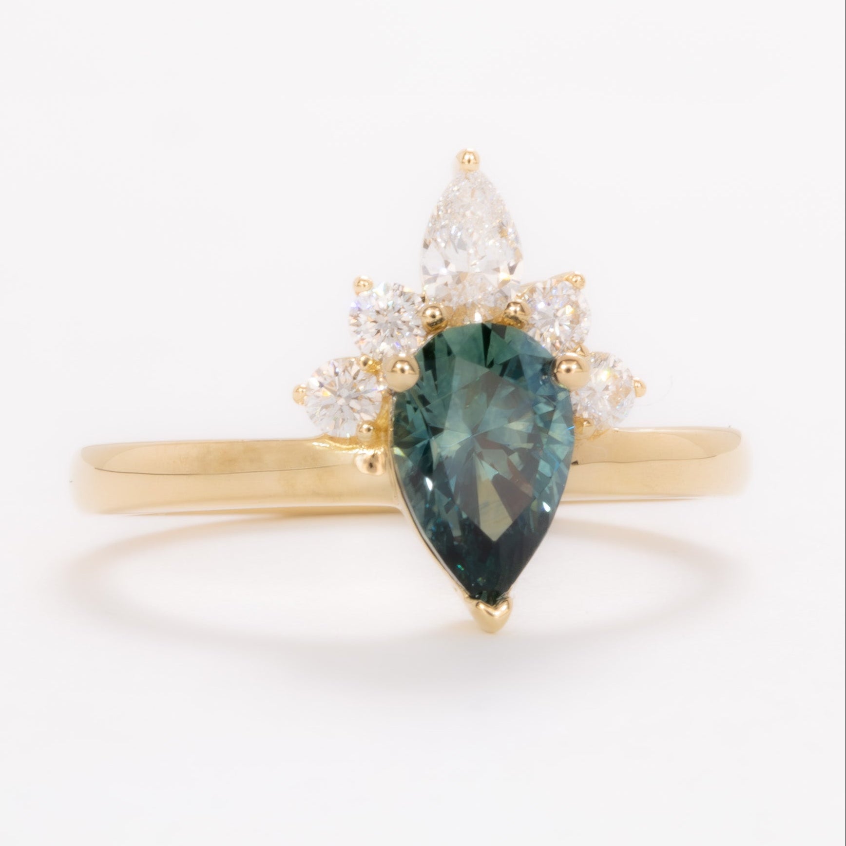 miley engagement ring with pear cut green sapphire