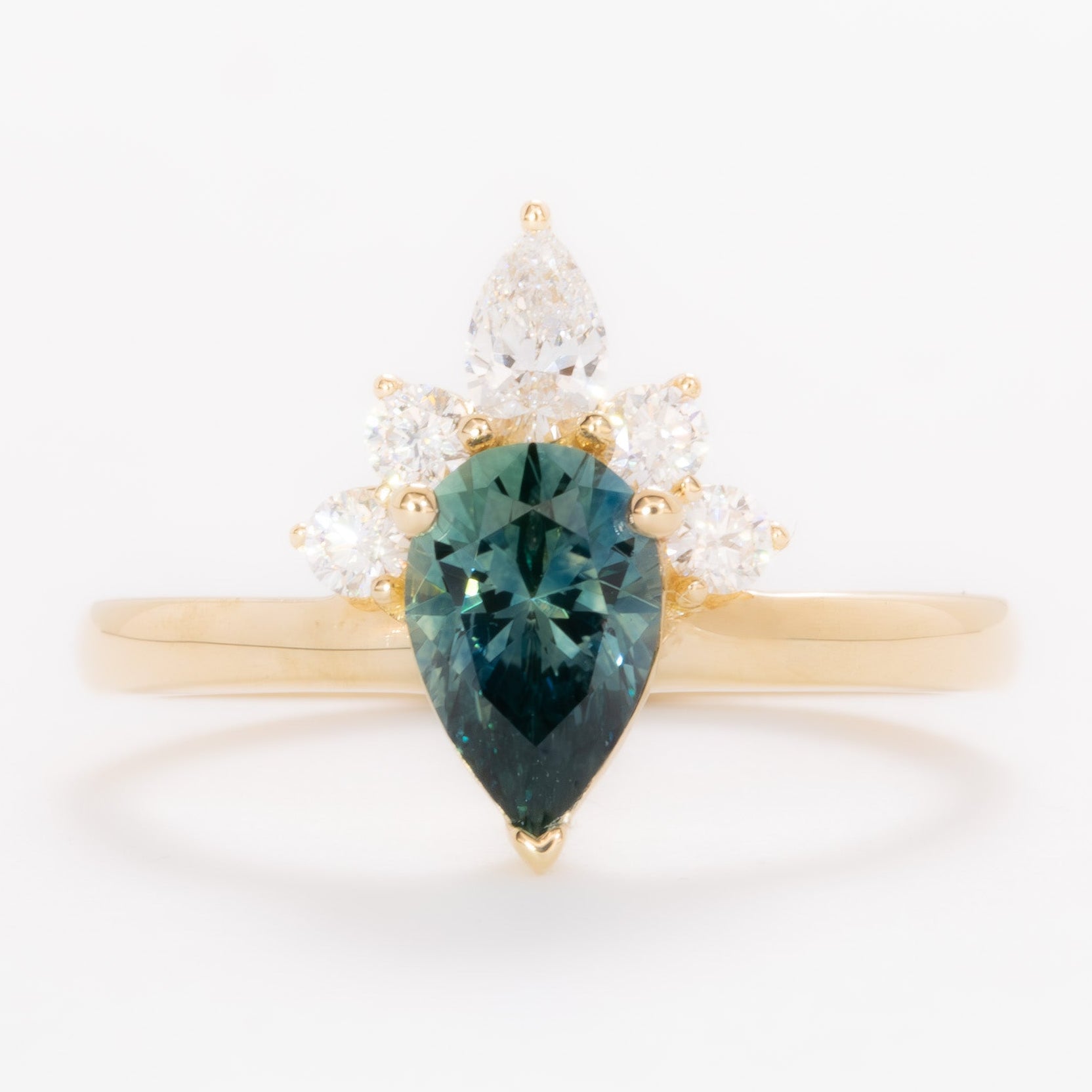 miley engagement ring with pear cut green sapphire