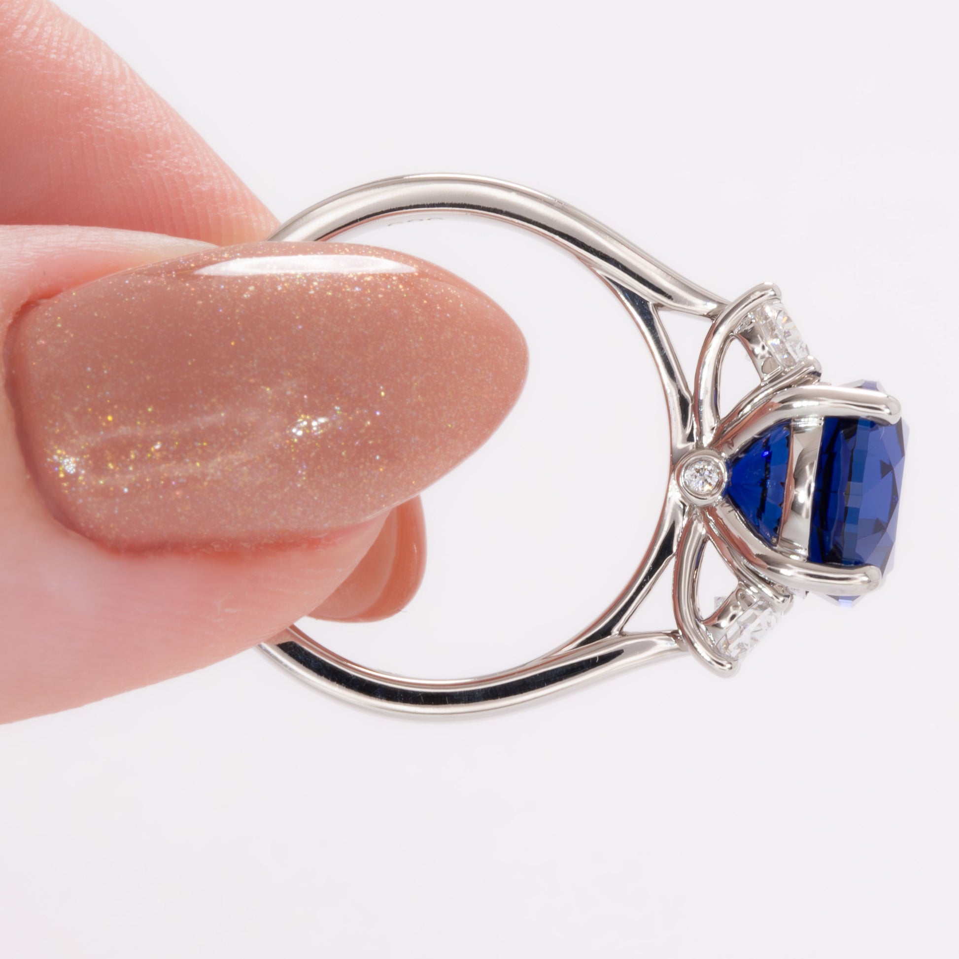 milly three stone engagement ring with oval royal blue lab sapphire