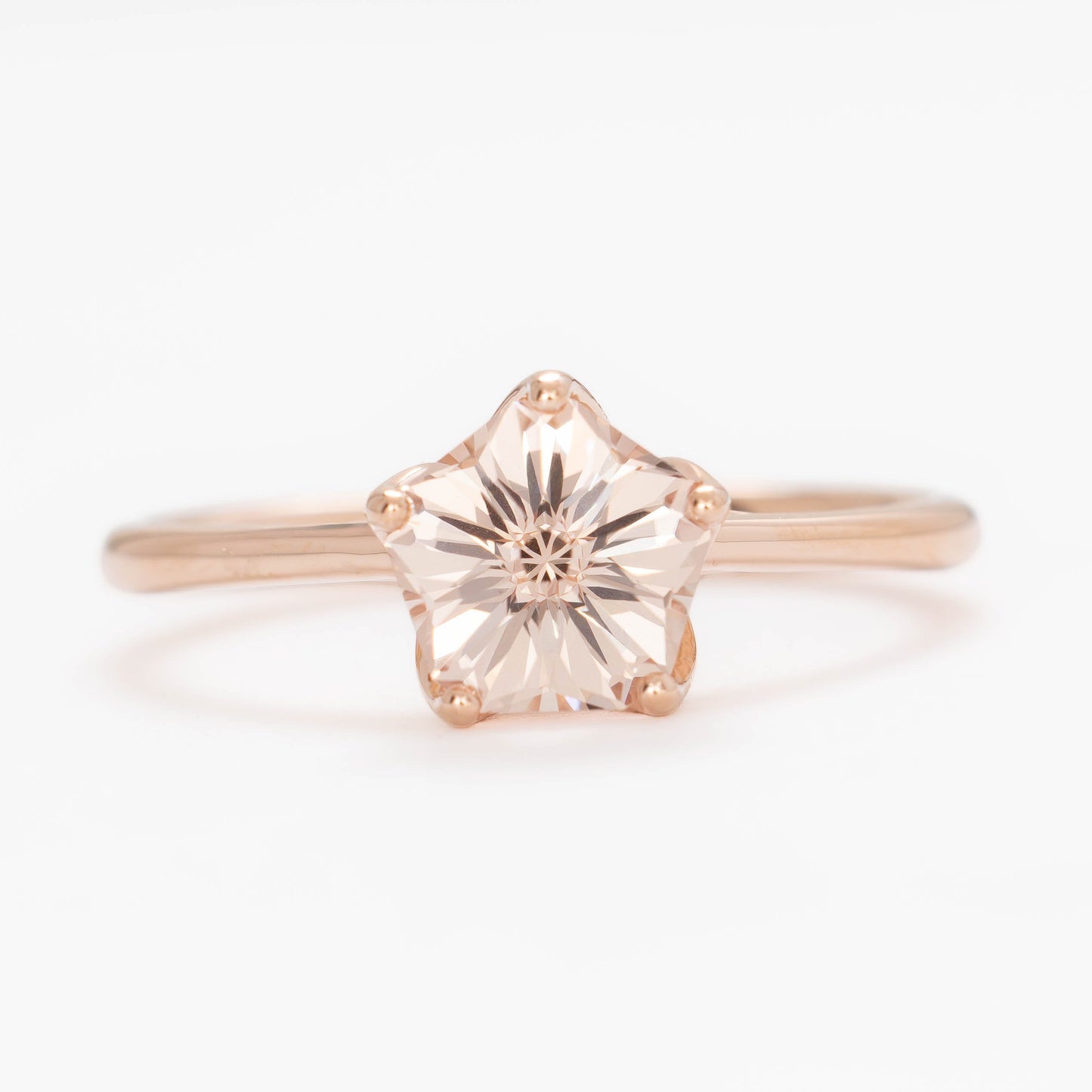 misha solitaire in rose gold with petal basket and pink lab sapphire flower