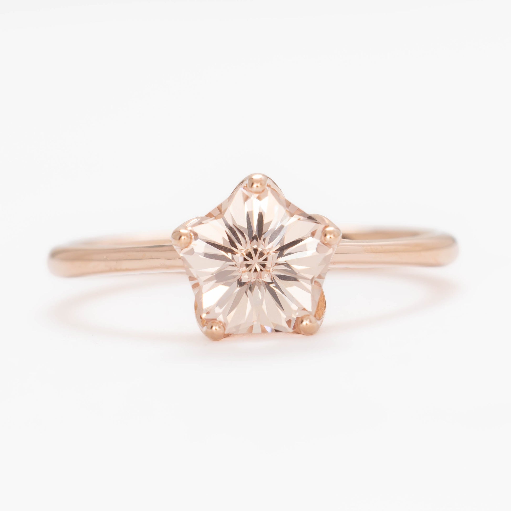 misha solitaire in rose gold with petal basket and pink lab sapphire flower