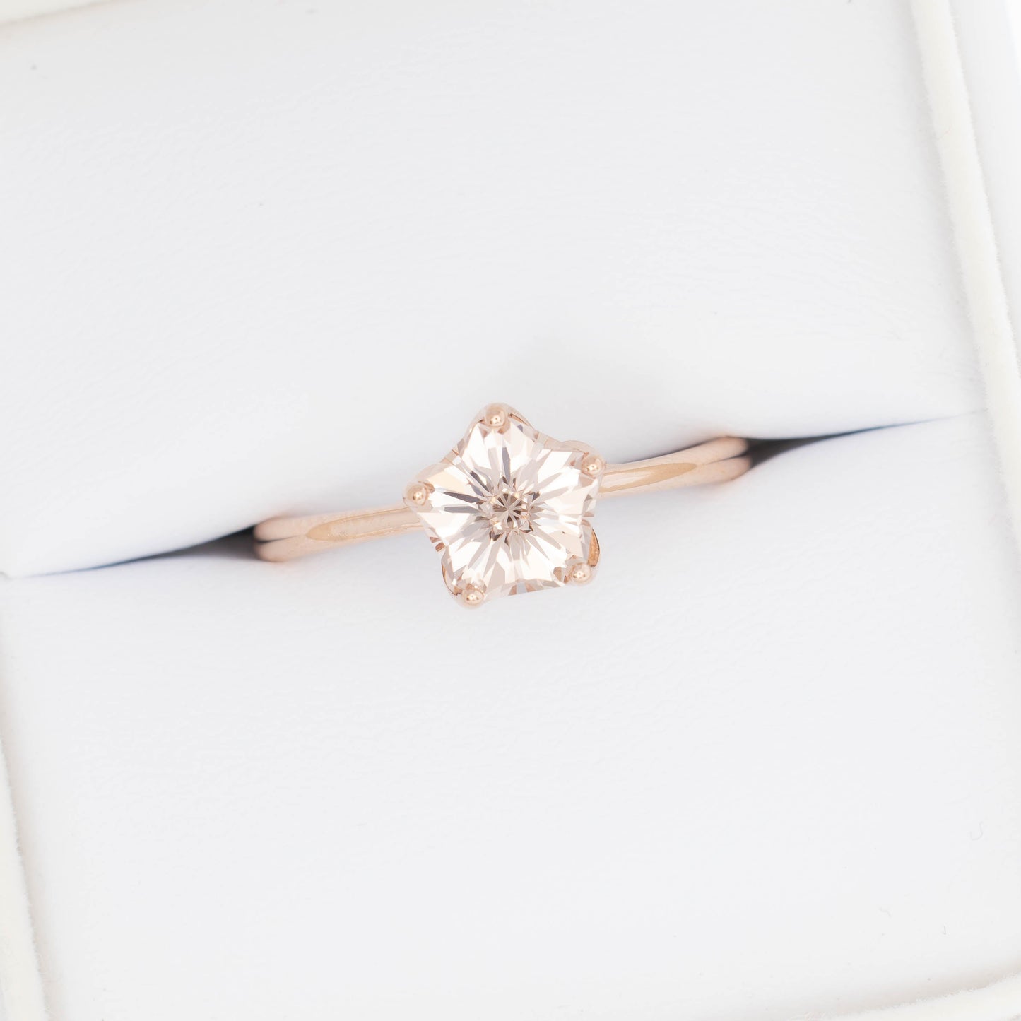 misha solitaire in rose gold with petal basket and pink lab sapphire flower