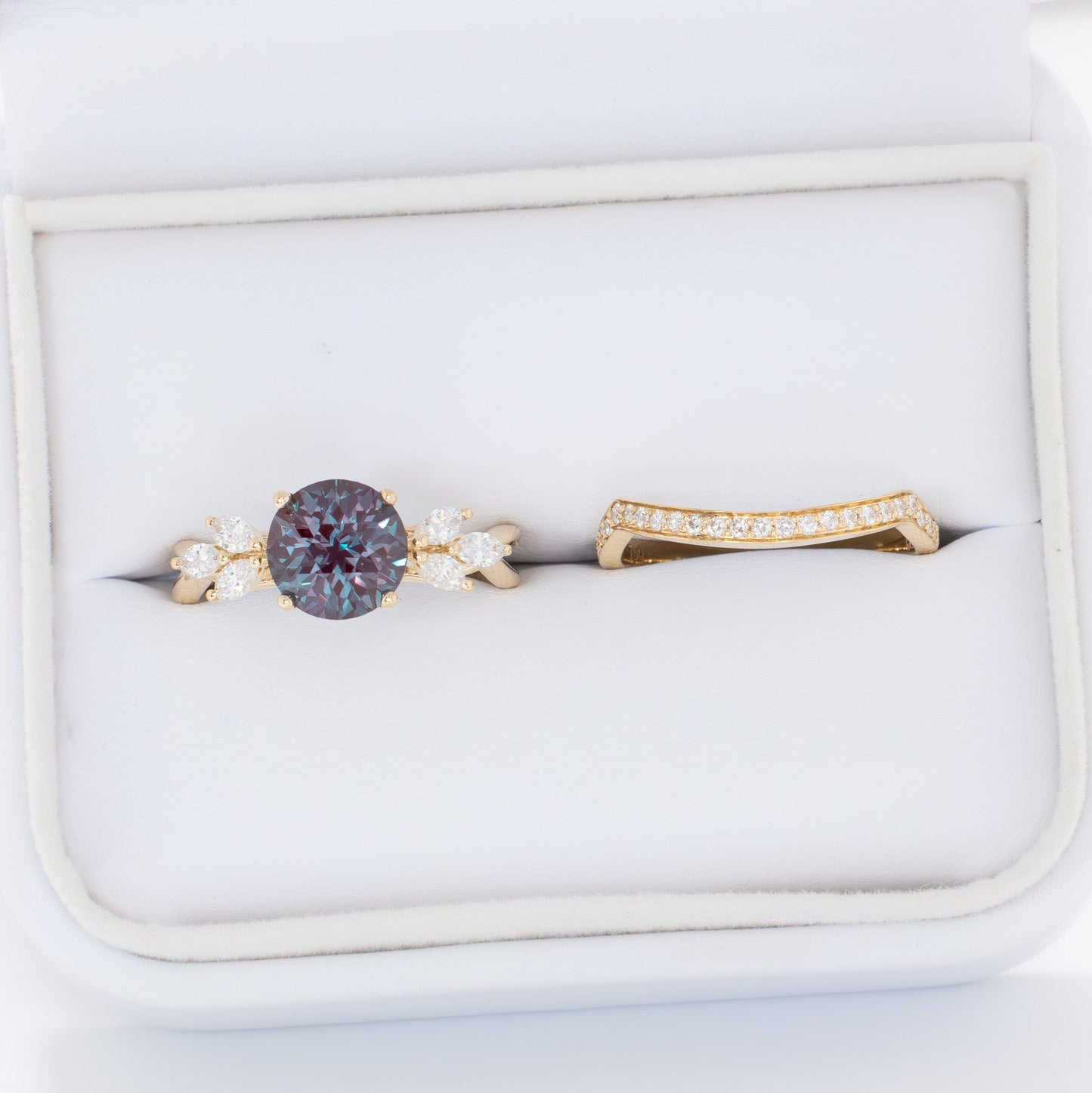 modified fifer wedding set in yellow gold with a round lab alexandrite 
