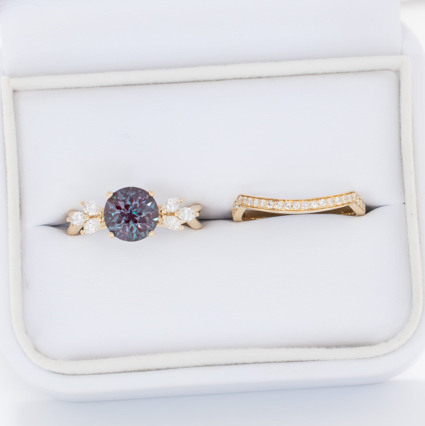 modified fifer wedding set in yellow gold with a round lab alexandrite 