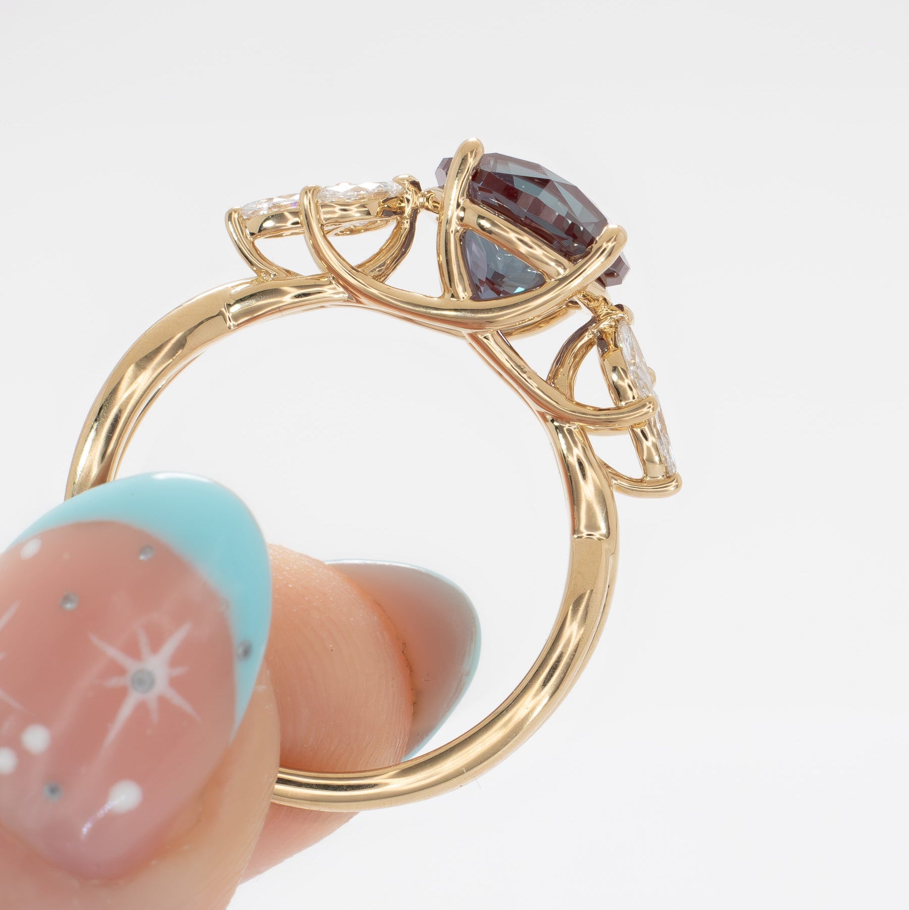 modified fifer wedding set in yellow gold with a round lab alexandrite 
