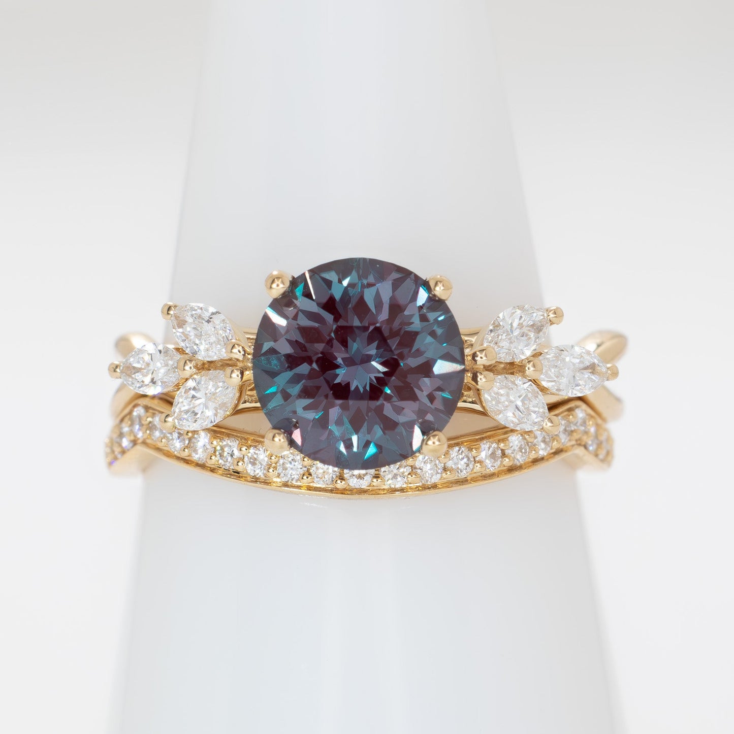 modified fifer wedding set in yellow gold with a round lab alexandrite 