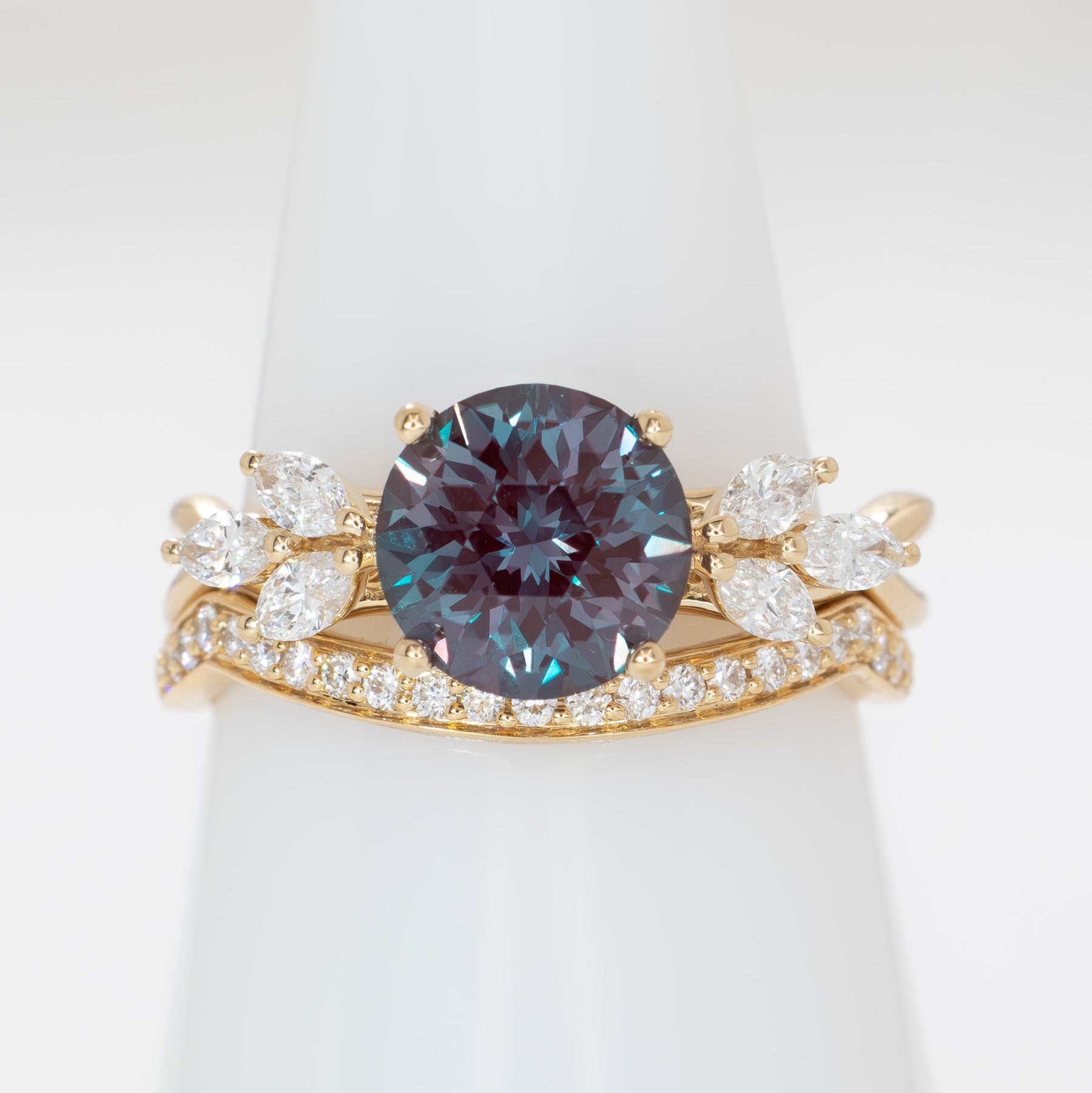 modified fifer wedding set in yellow gold with a round lab alexandrite 