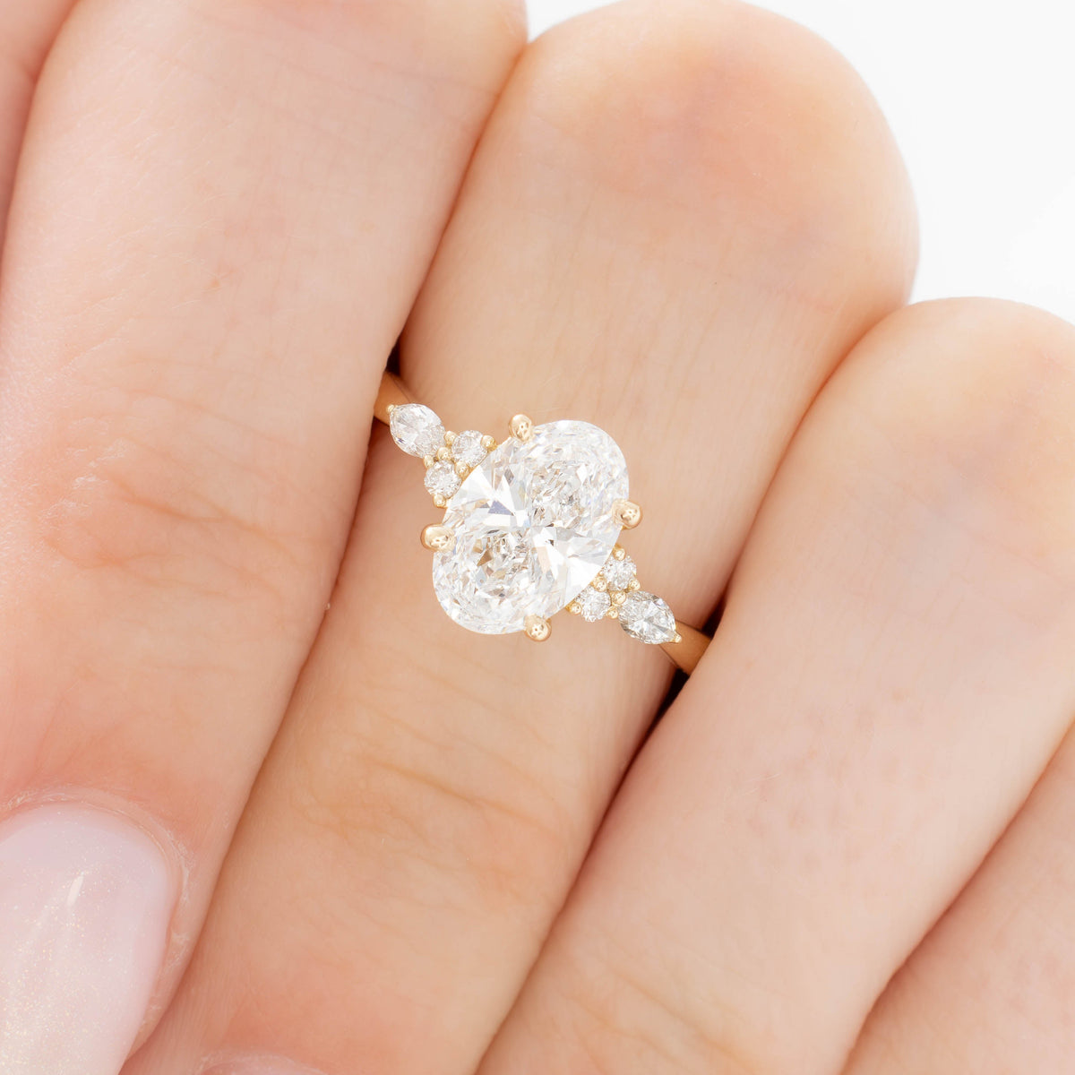 modified natalia ring in yellow gold with lab diamond oval