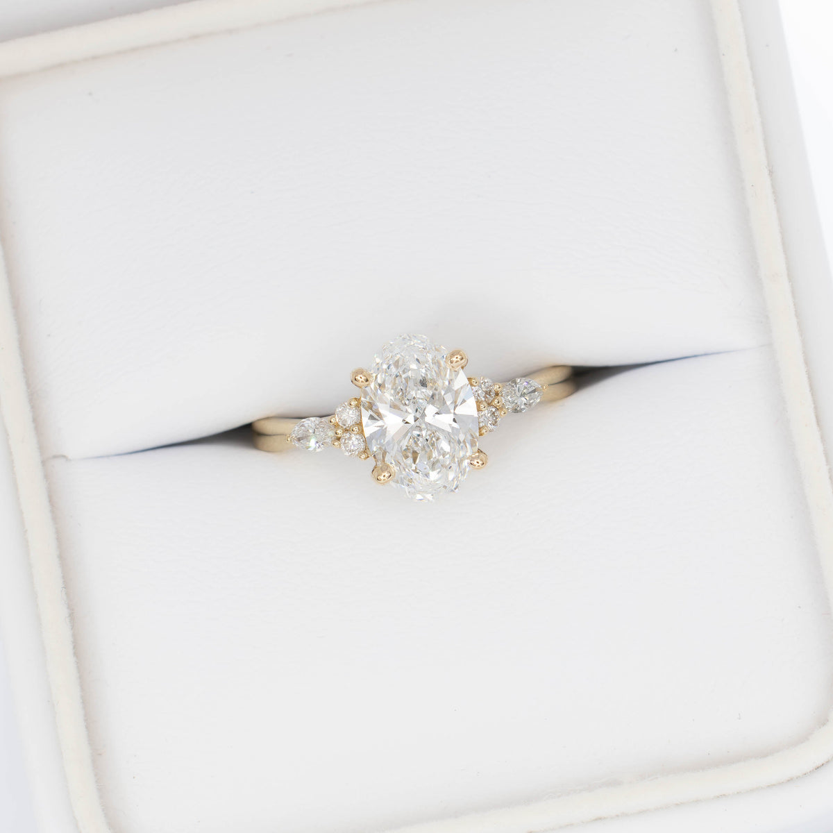 modified natalia ring in yellow gold with lab diamond oval