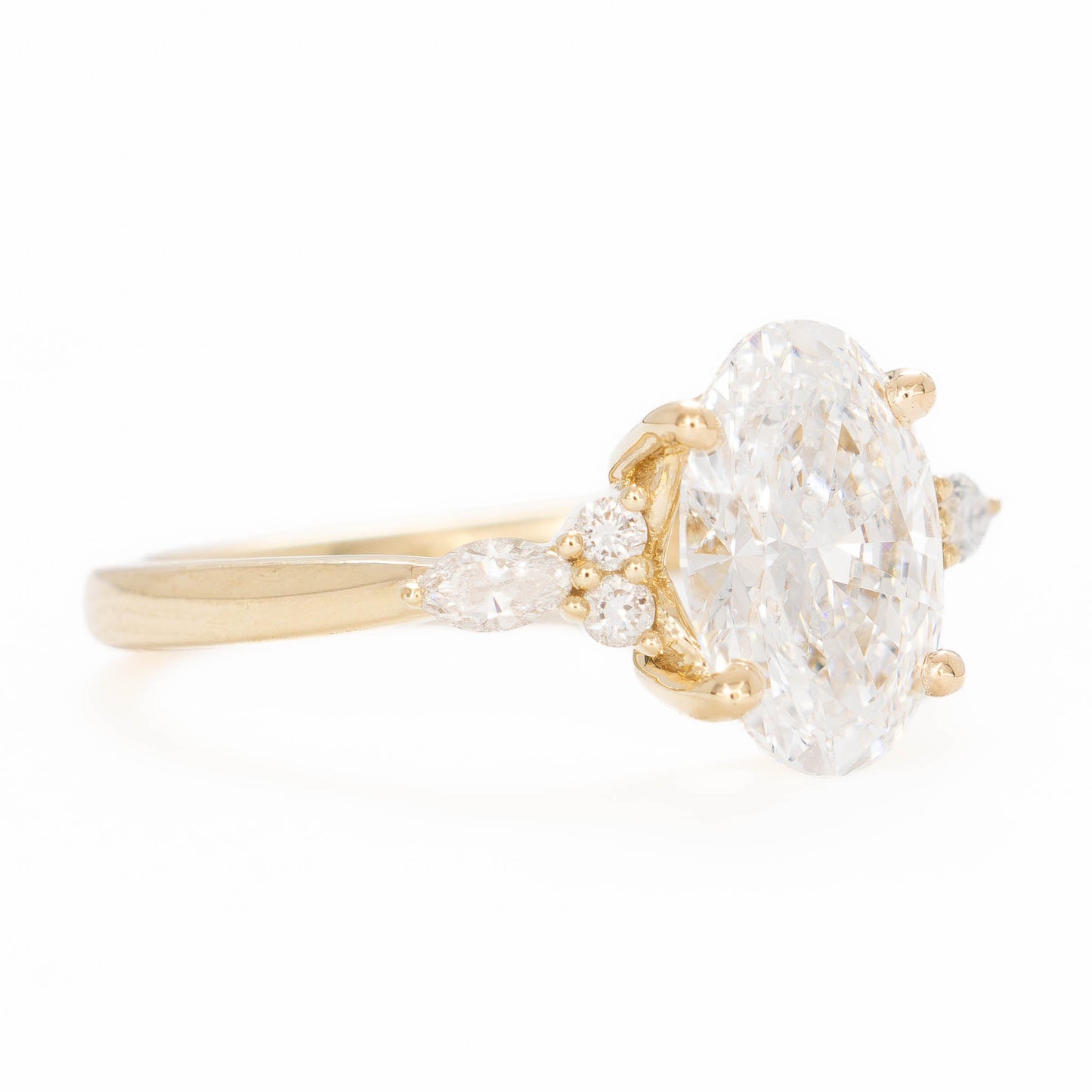 modified natalia ring in yellow gold with lab diamond oval